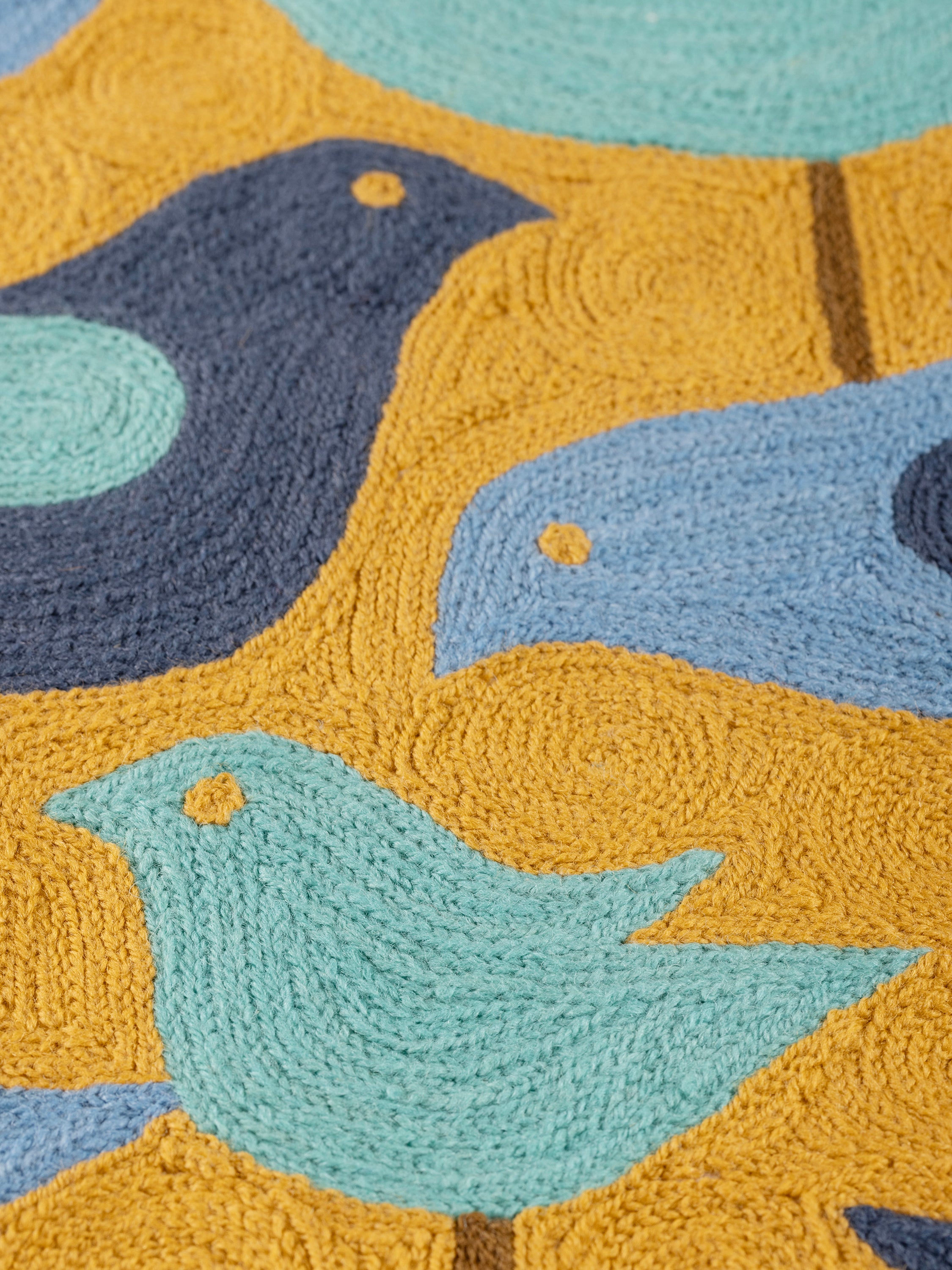 Square embroidered pillow with a bold and contemporary bird motif, blending elegance and creativity for sofas, chairs, or beds