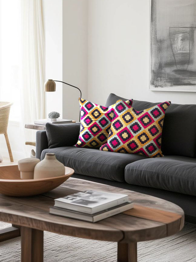 Natural cotton throw pillow 20″×20″ with vibrant geometric embroidery and textured form — sophisticated artisan accent