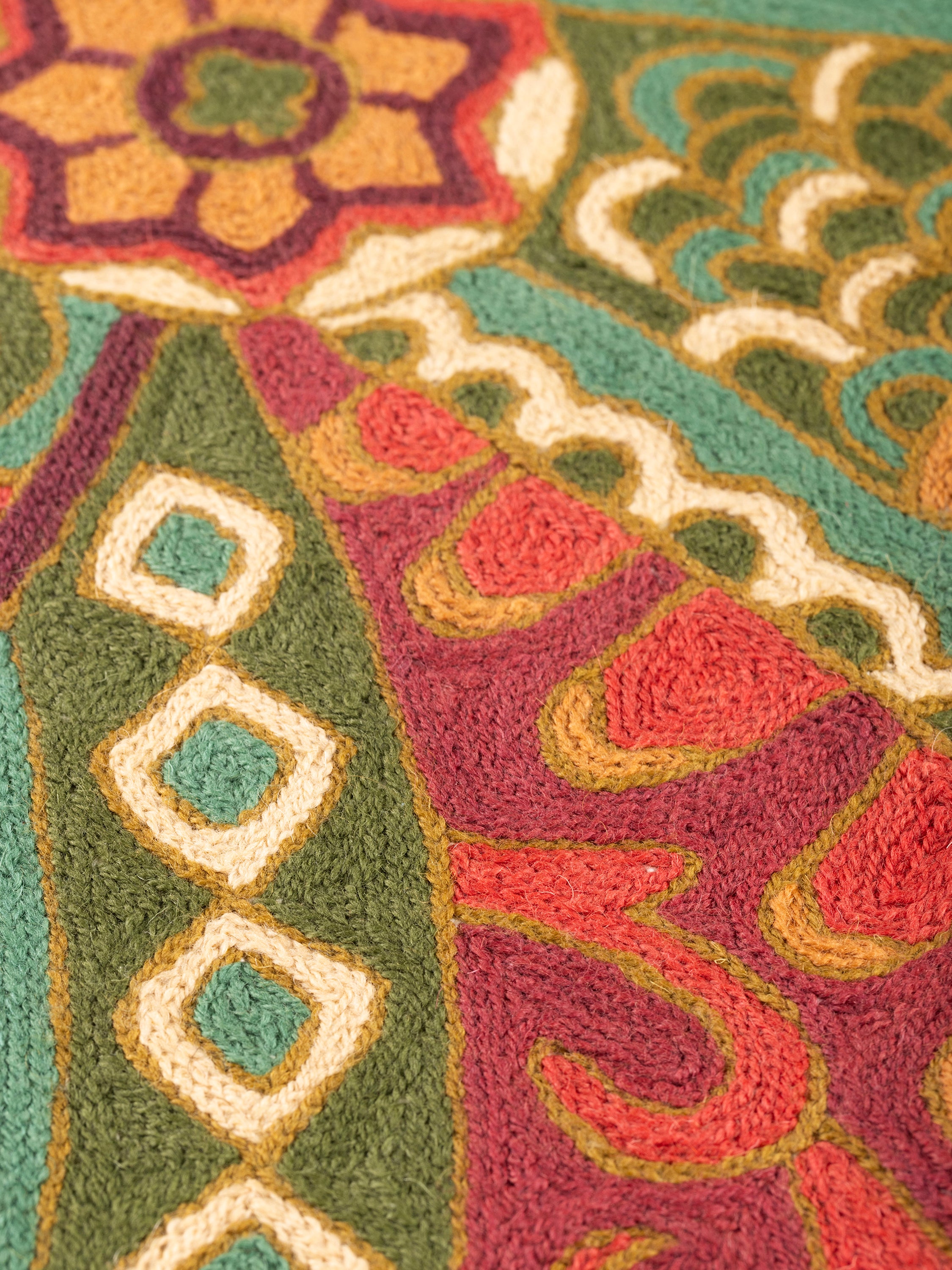 Luxury decorative pillow with intricate embroidery and a vibrant, colorful design, ideal for sofas, armchairs, or beds