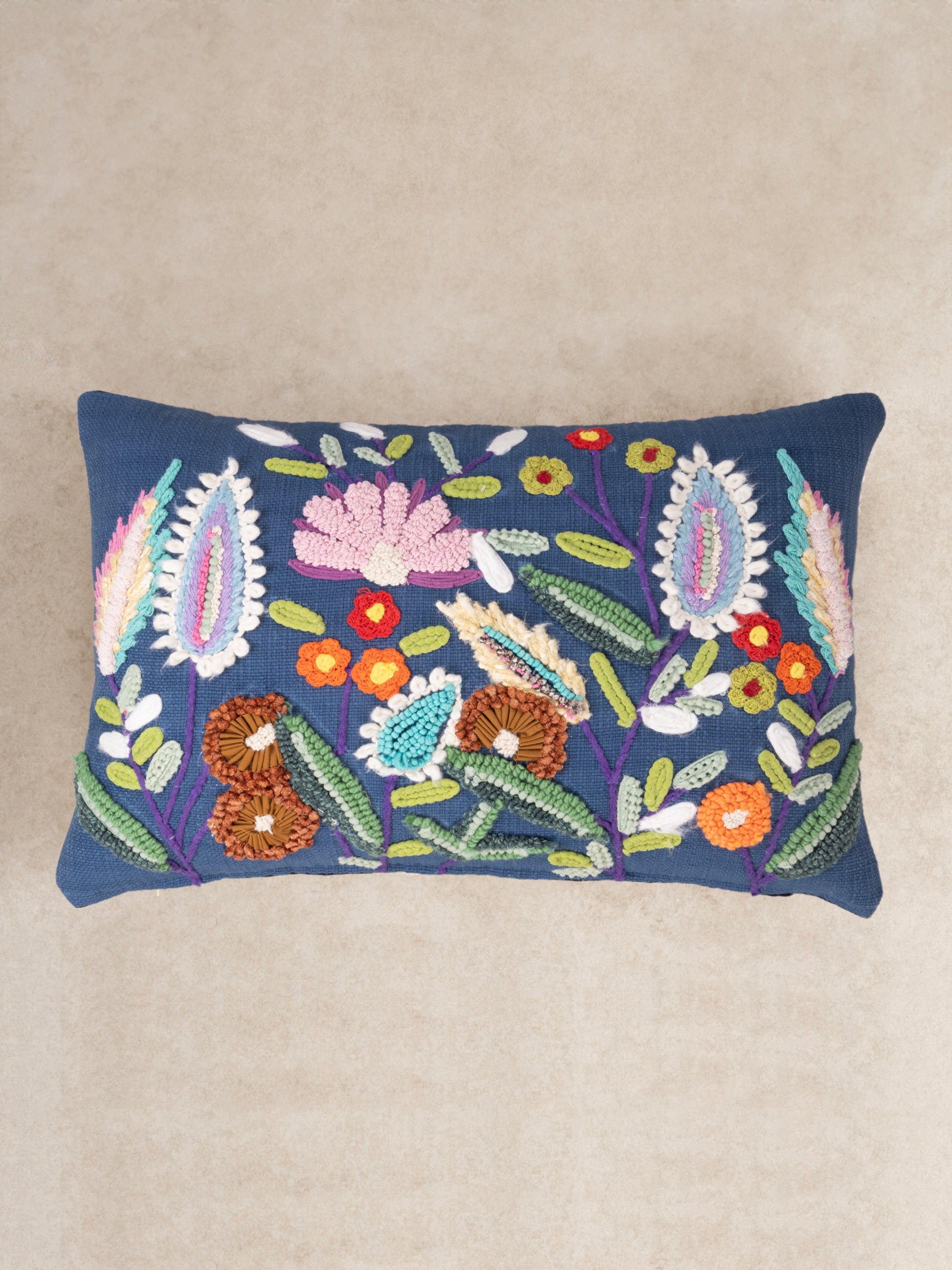 Handcrafted cotton throw pillow with bold punch-needle texture in multicolour hues — artisan luxury accent