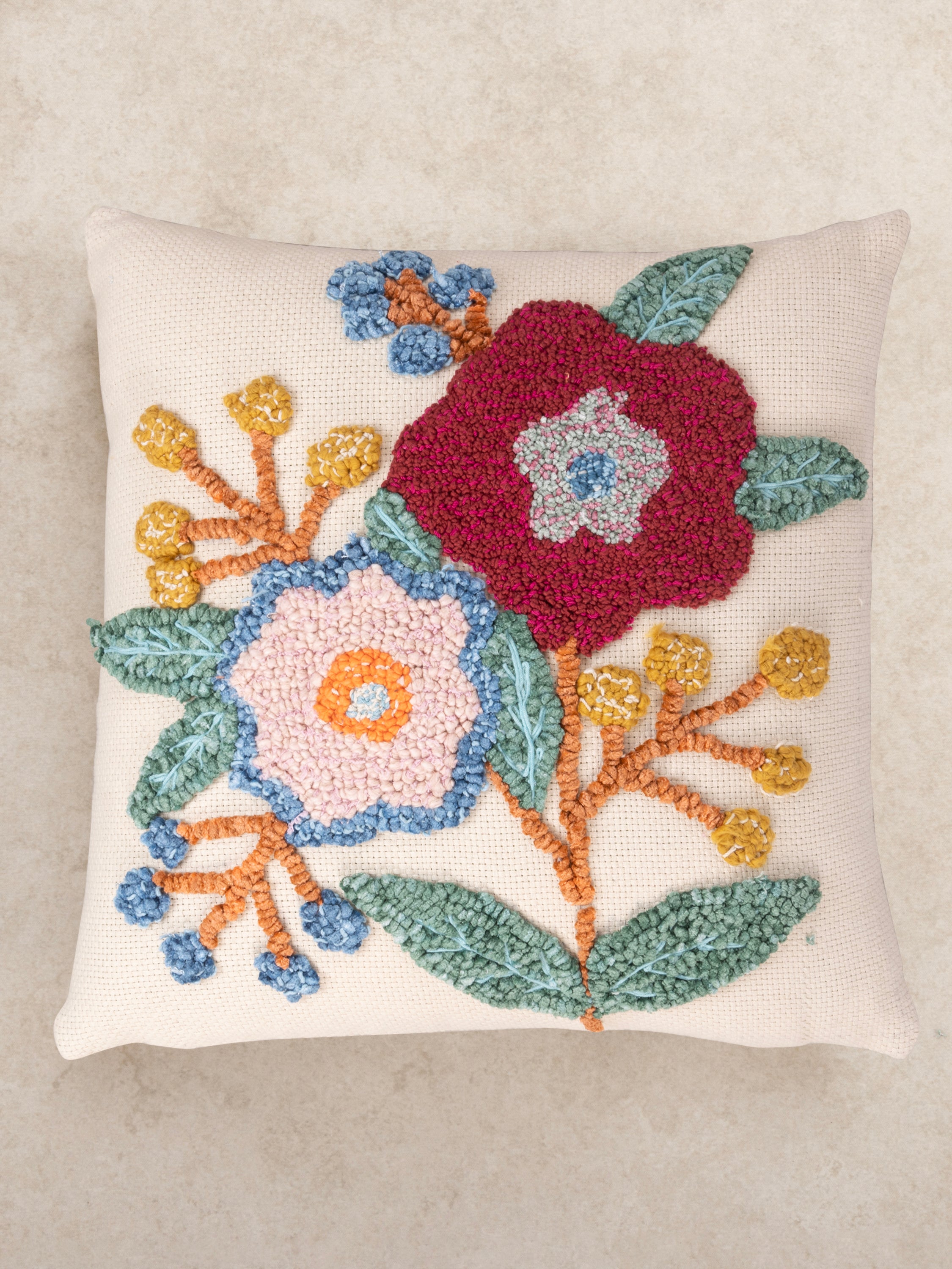 Textured decorative pillow 20″×20″ in natural cotton featuring layered stitching and multicolored pattern — refined home décor piece