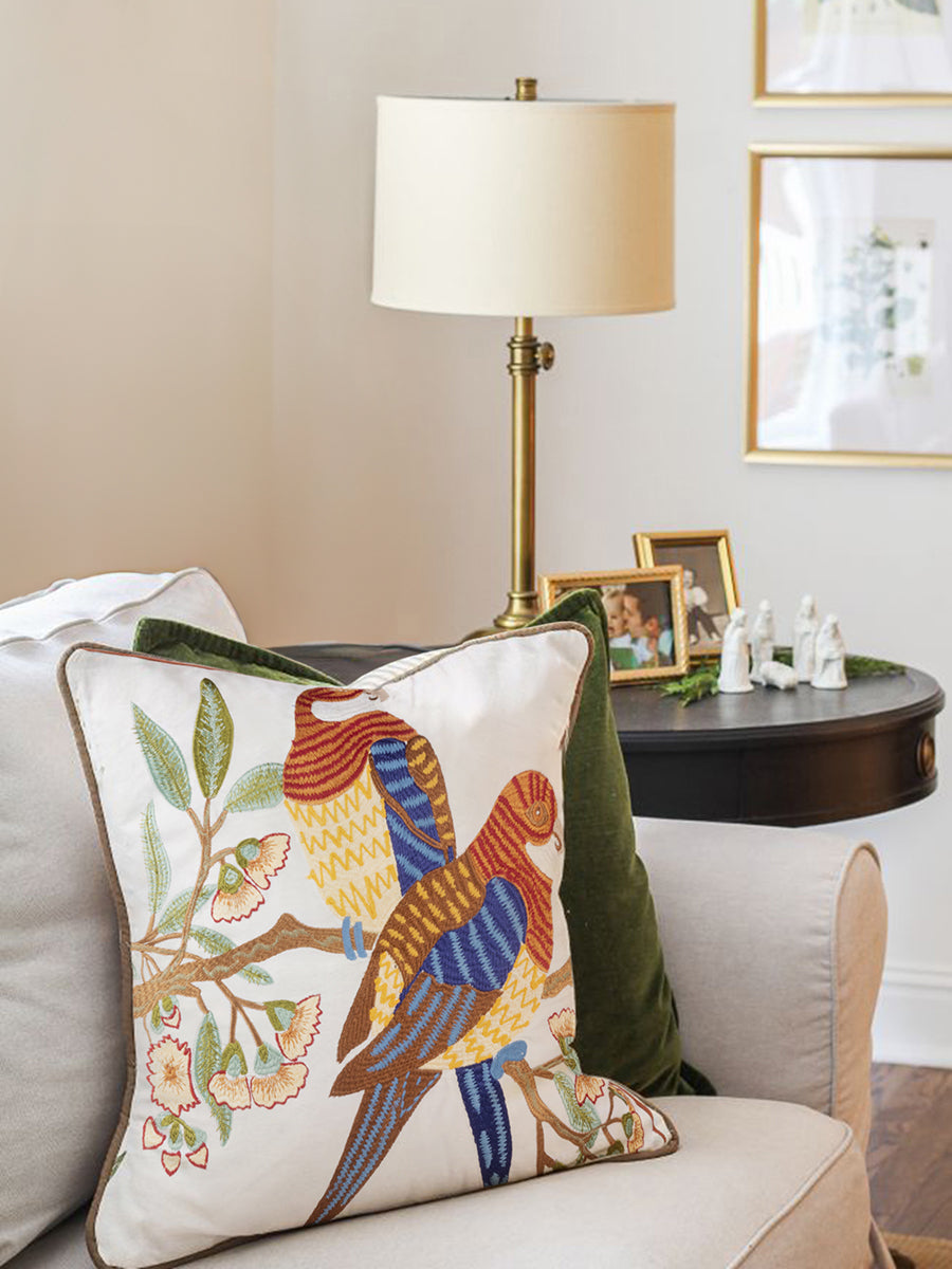 Natural cotton throw pillow 20″×20″ with embroidered birds and botanical motifs — sophisticated artisan accent