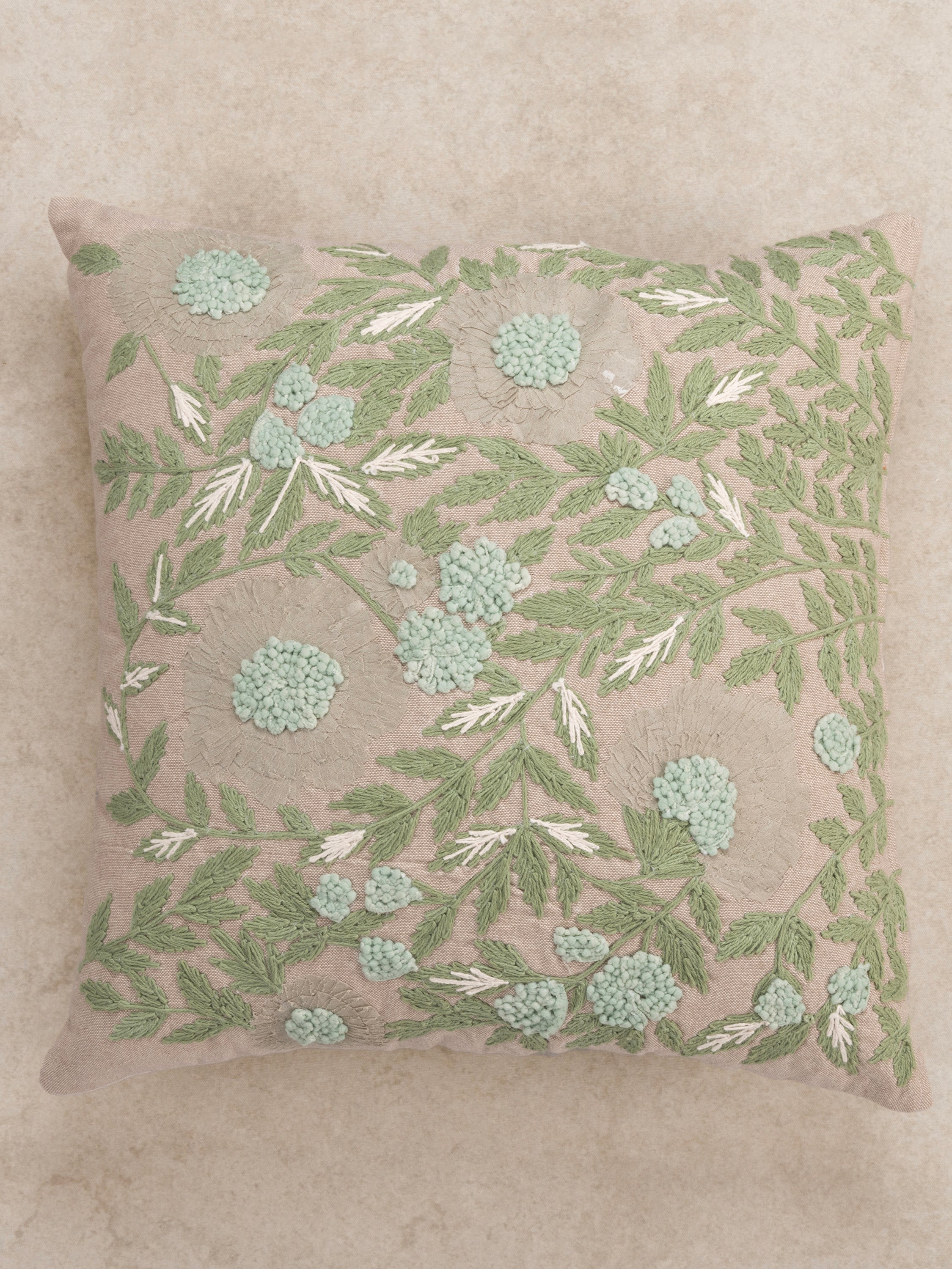 Textured botanical embroidery pillow 20″×20″ in natural cotton with layered detailing — refined decorative piece