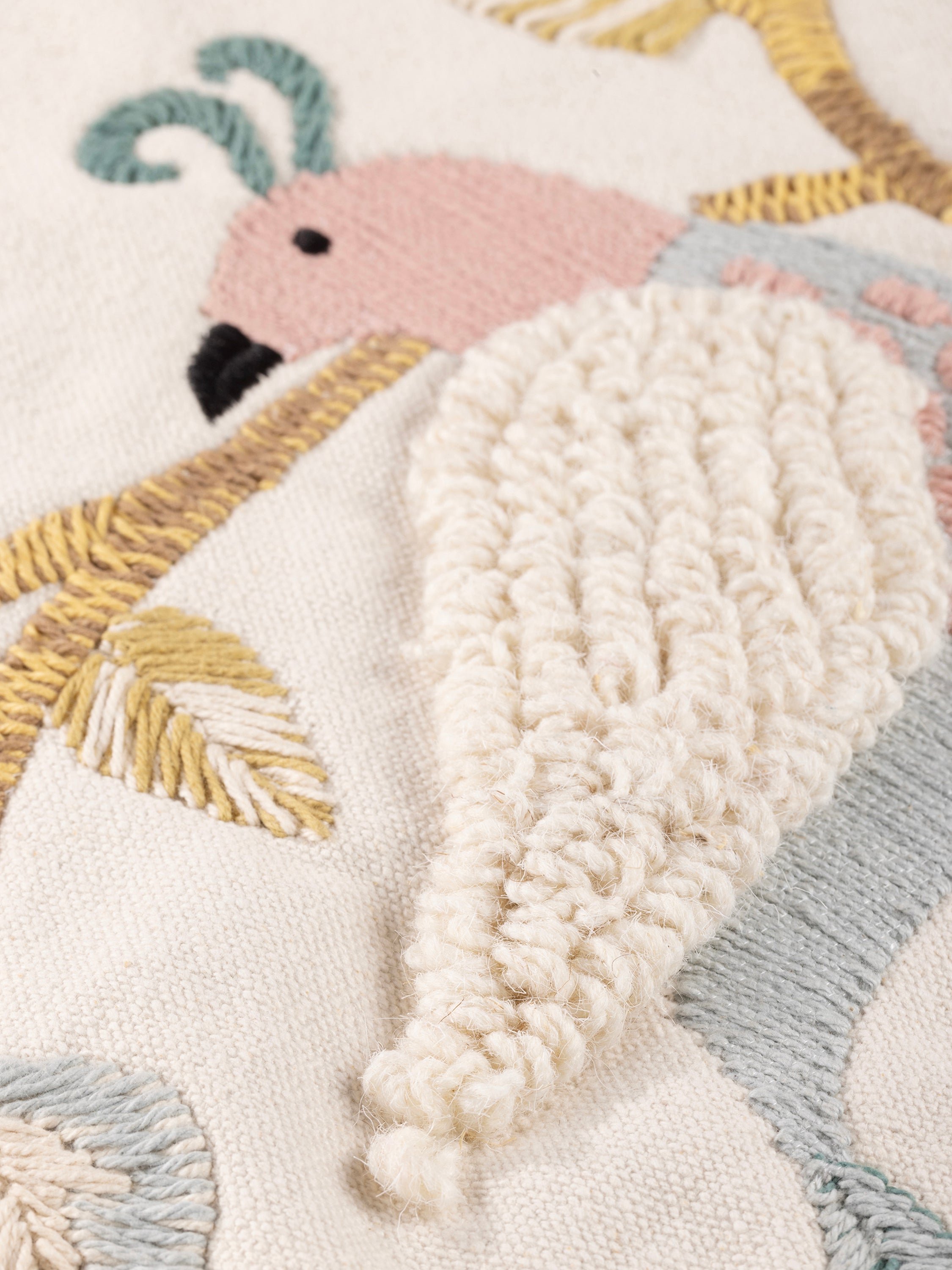 Decorative throw pillow with raised embroidery of birds and foliage in cotton — handcrafted design accessory