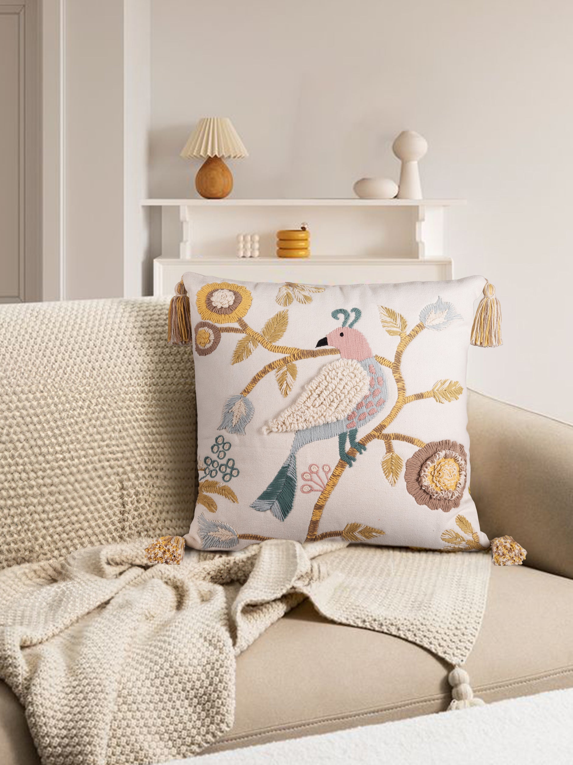Natural cotton throw pillow 20″×20″ with multicolored bird and botanical embroidery — sophisticated artisan accent