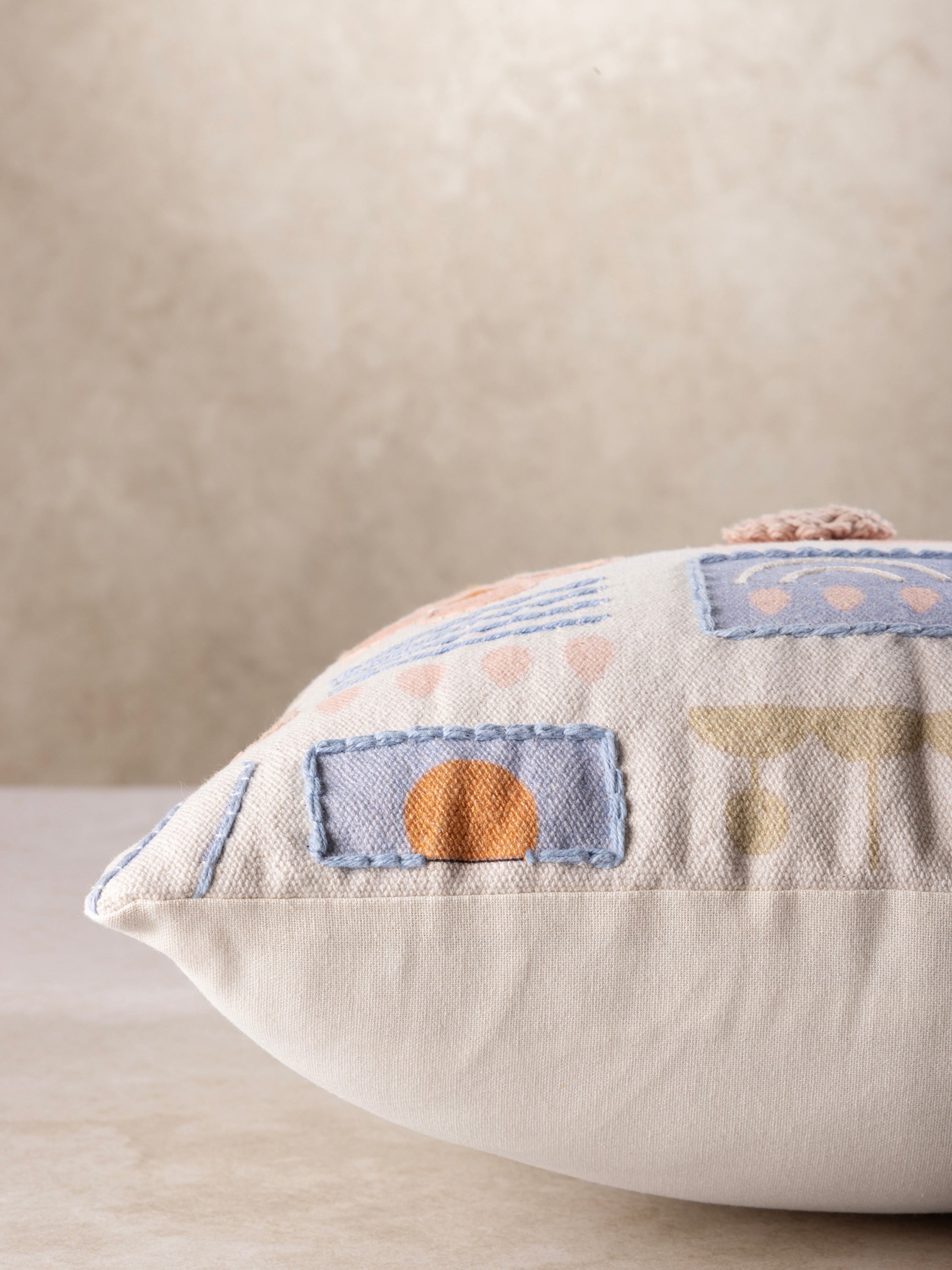 Artisan-made cotton pillow featuring floral, plant and celestial motifs in print and embroidery — luxury home layer