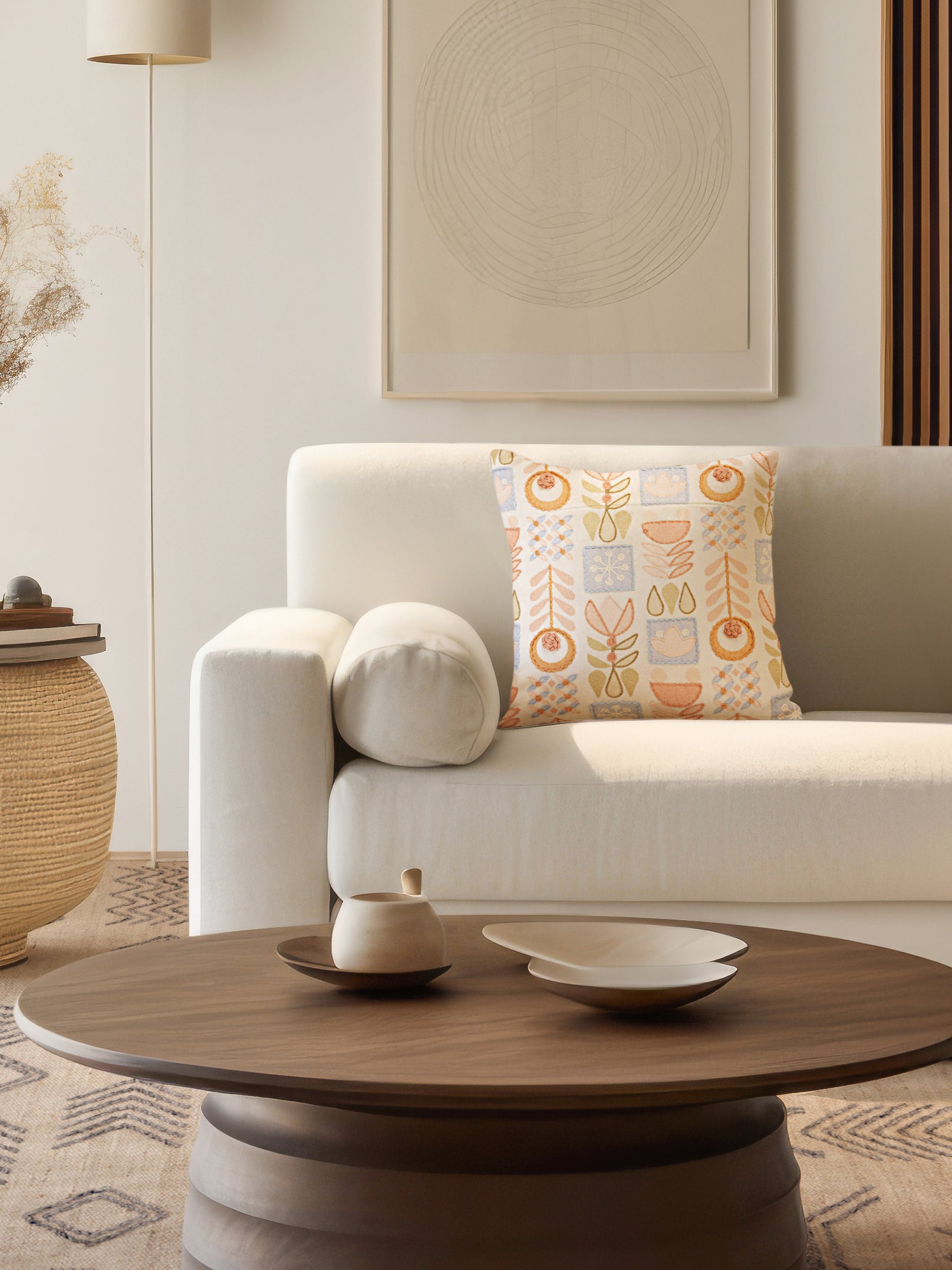 Natural cotton pillow featuring hand-stitched geometric pattern in soft pastels — elegant artisan accent