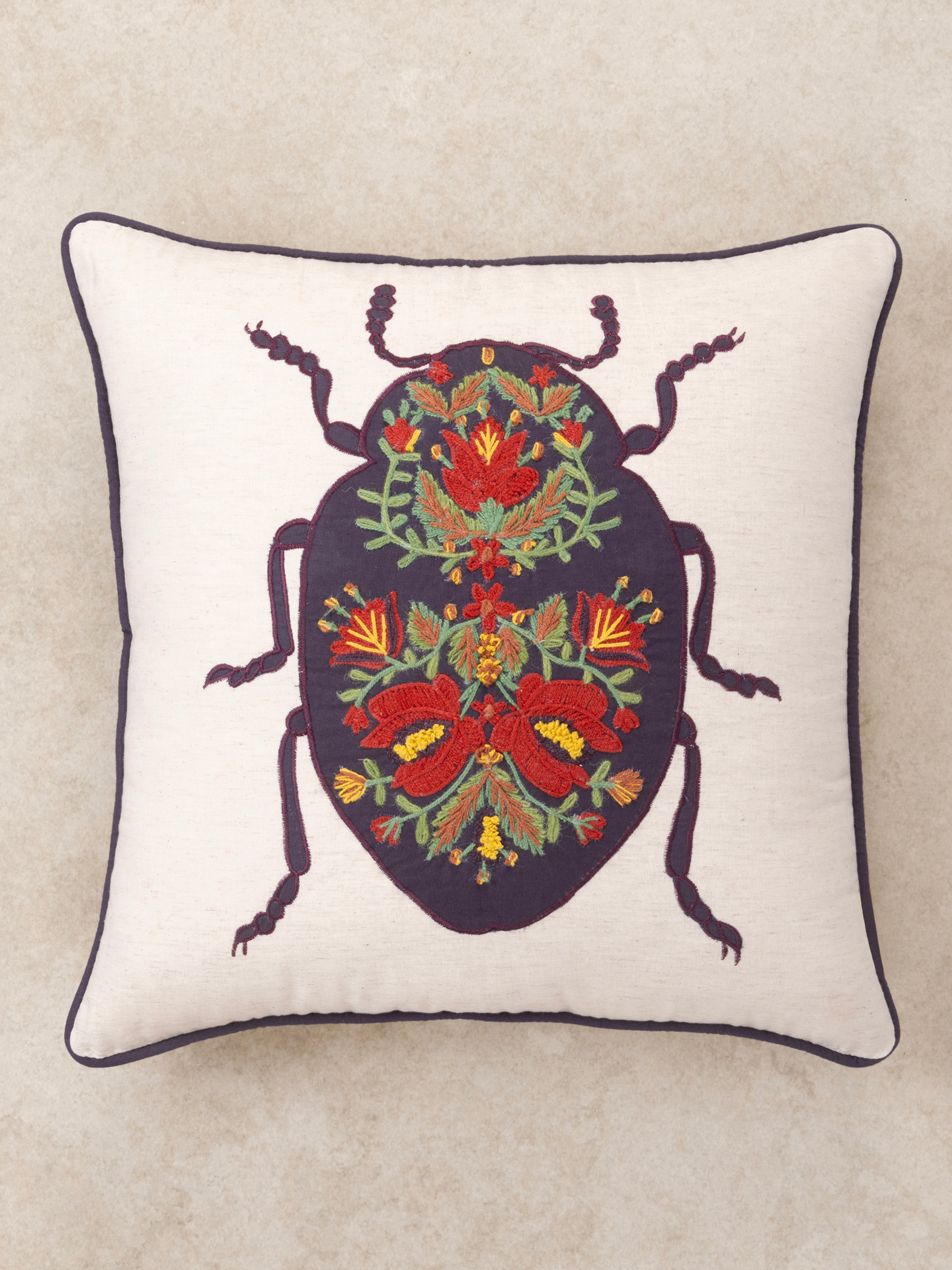 Natural cotton decorative pillow 20″×20″ featuring rich embroidery of insect motif and florals — refined decorative piece