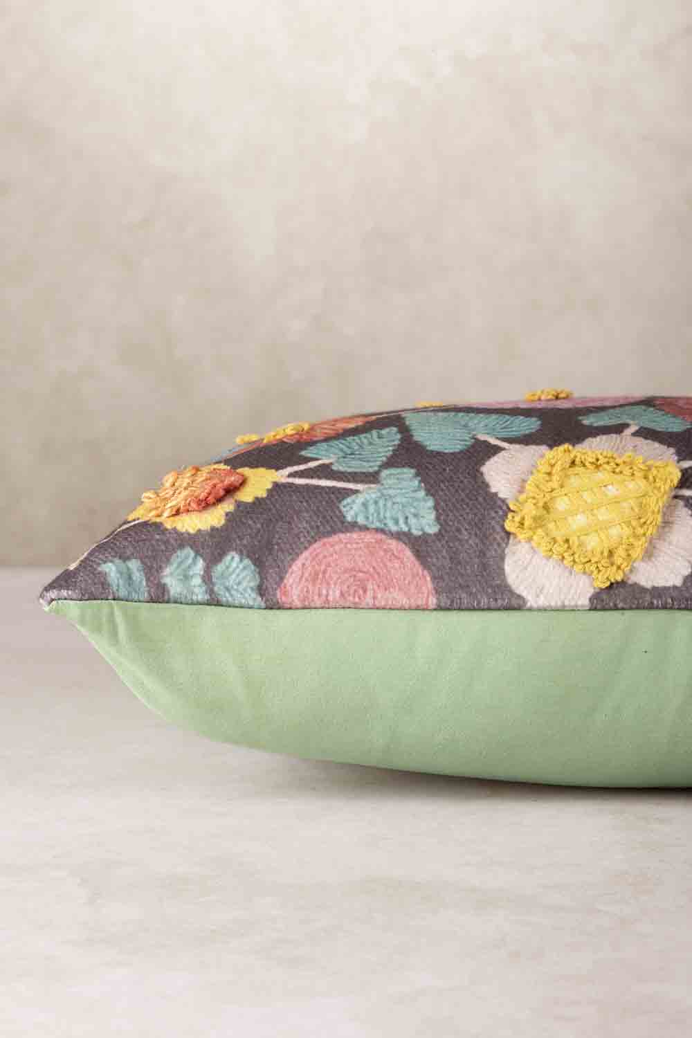 Side profile of rectangular throw pillow showing plush filled structure, soft rounded edges, and contrast between patterned front and solid backing