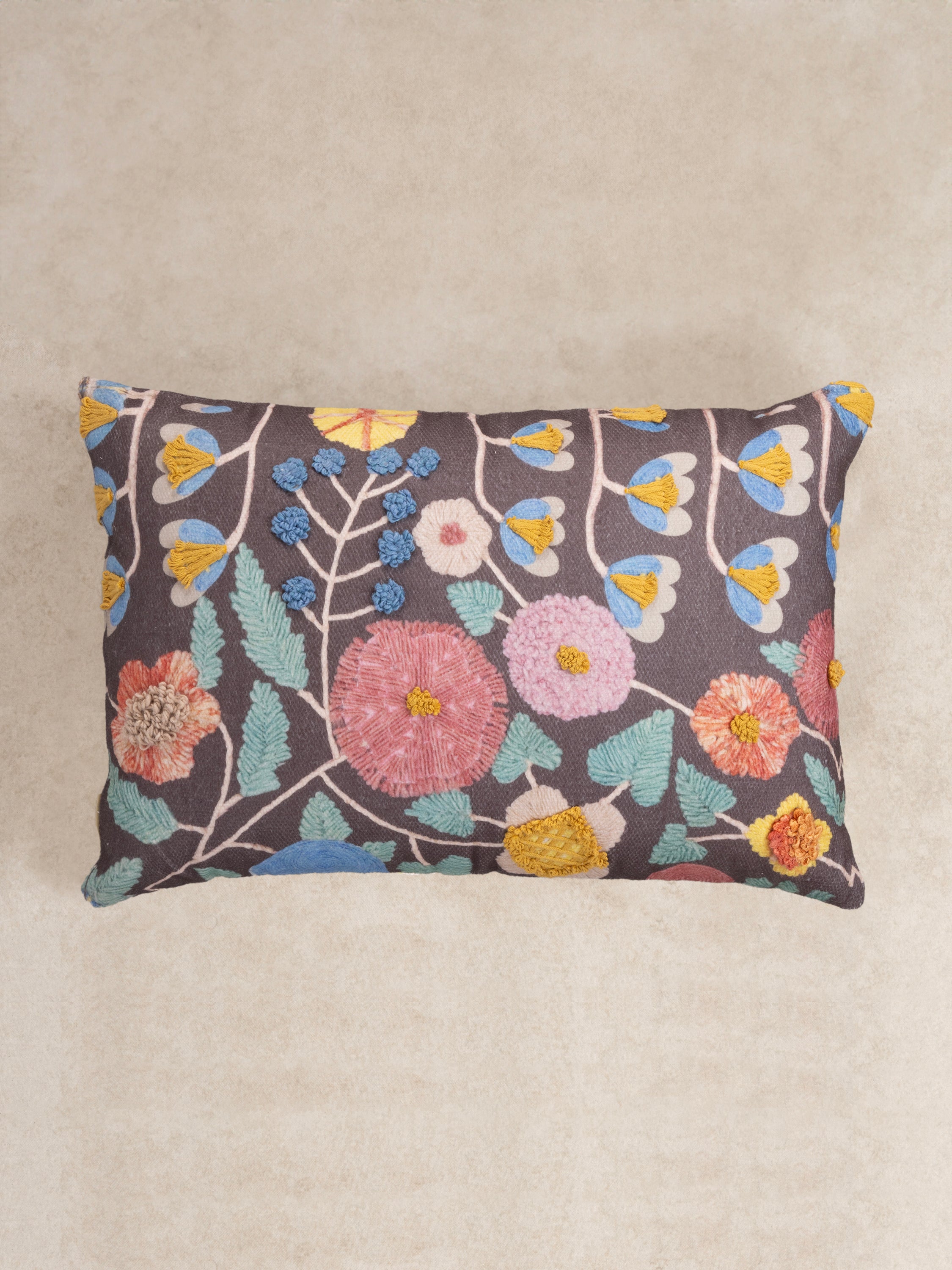 Handcrafted pillow with printed and embroidered floral motifs on cotton-wool blend — artisan home accent