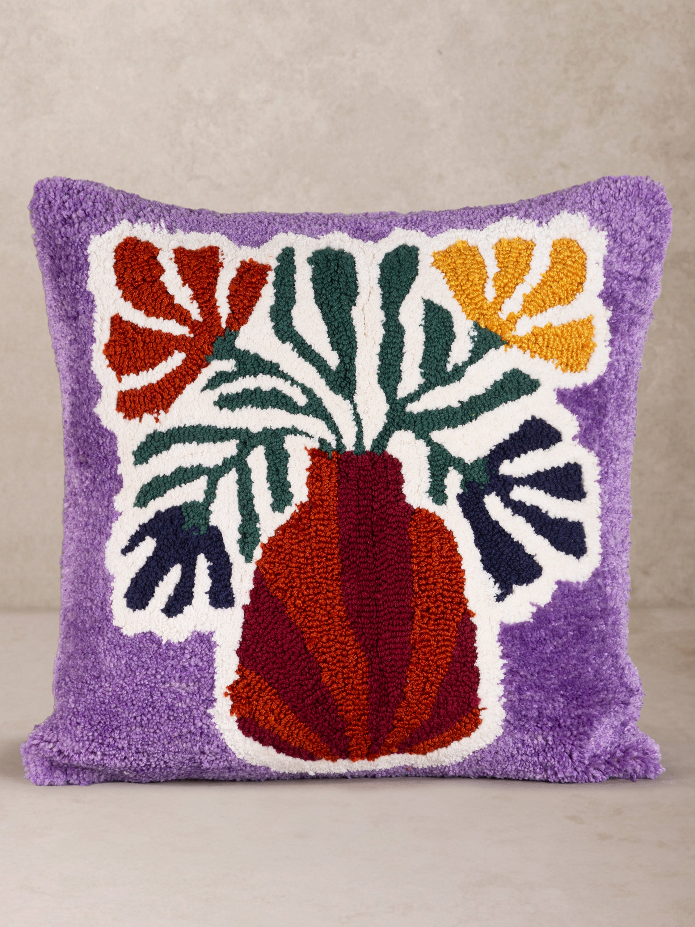 Hand-crafted cotton and wool throw pillow with raised floral embroidery on lilac ground — artisan luxury accent