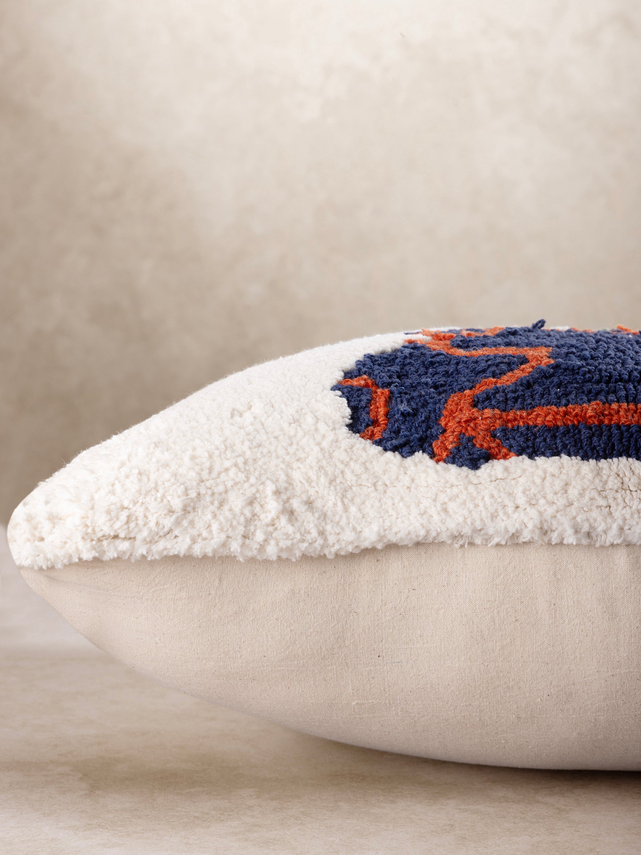 Artisan-made throw pillow featuring raised floral design and tactile texture — luxury home accent