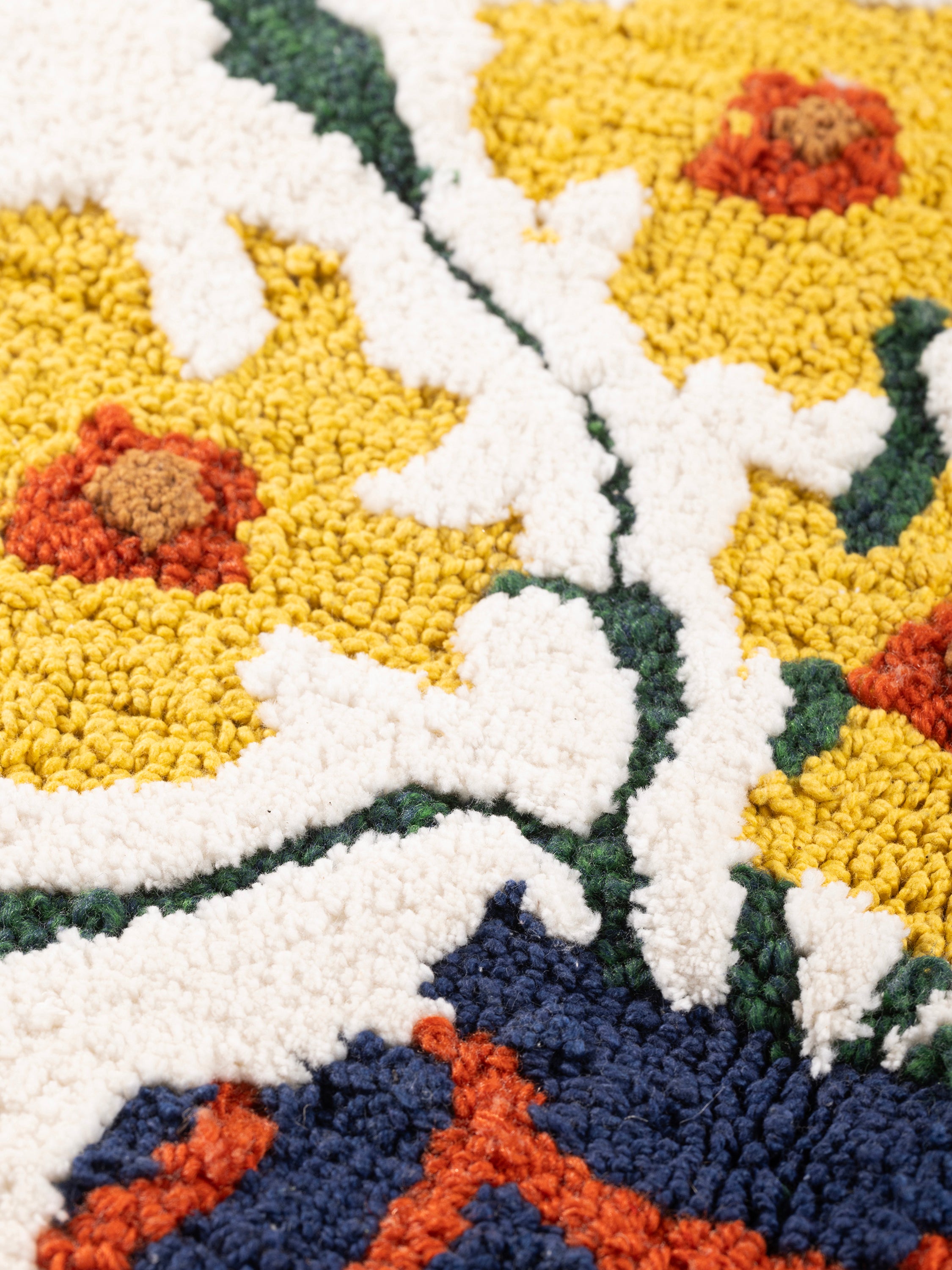 Cotton and wool decorative pillow with intricate floral detailing and soft surface — handcrafted design