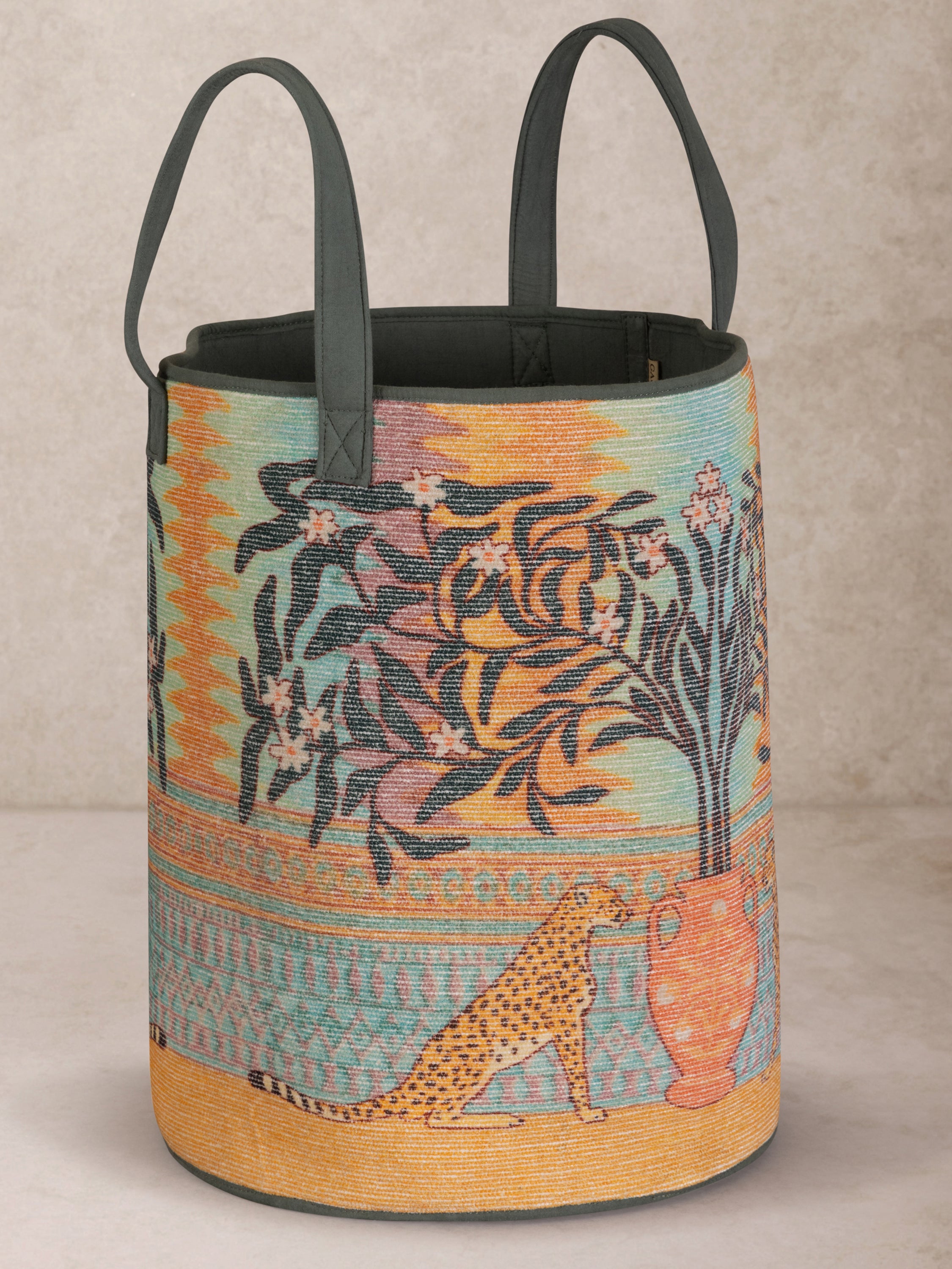 Hand-crafted laundry hamper with vibrant tropical wildlife print and reinforced handles — artisan luxury organiser