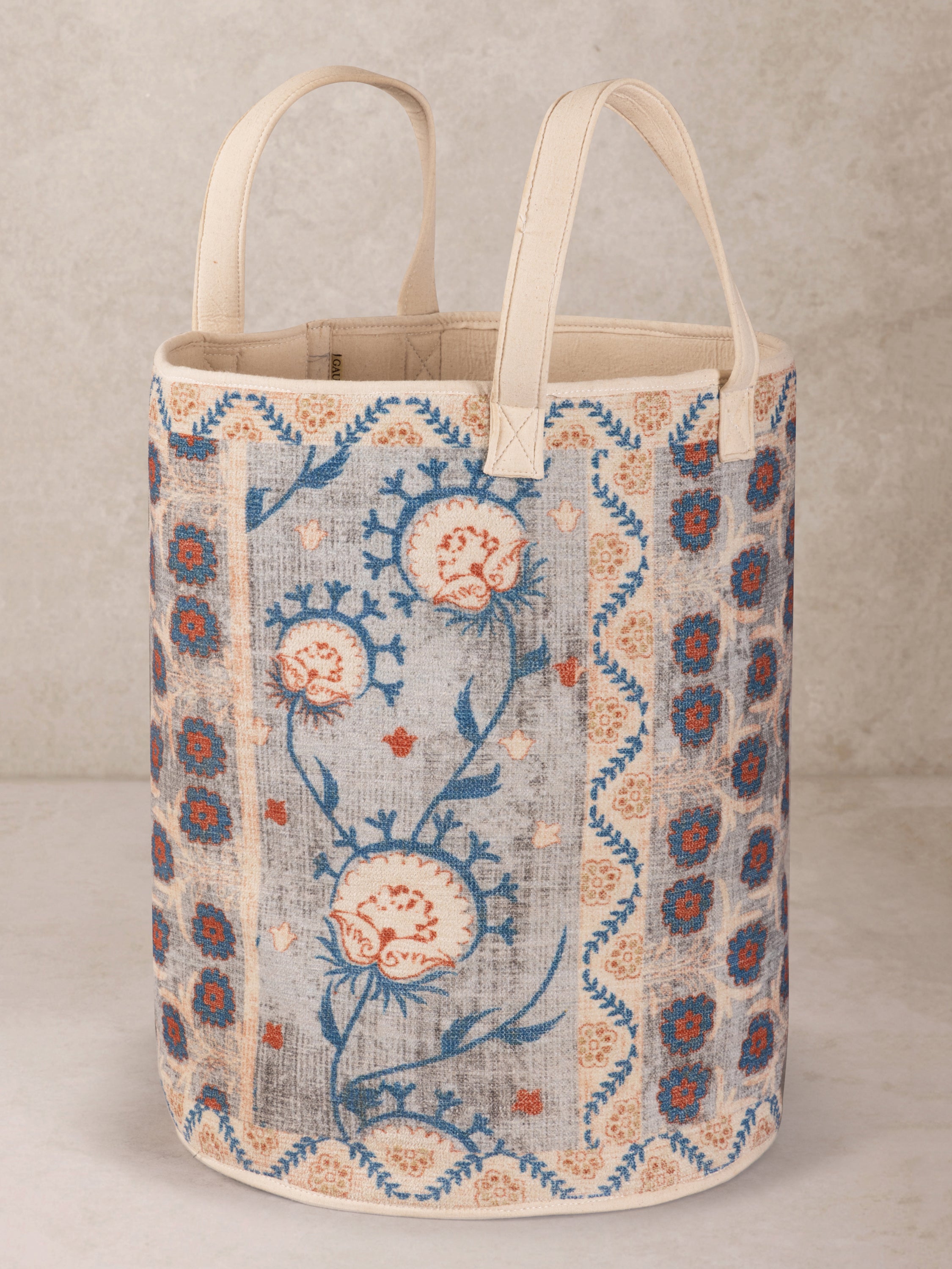 Handcrafted floral printed storage hamper with structured body and soft tones — artisan organizer