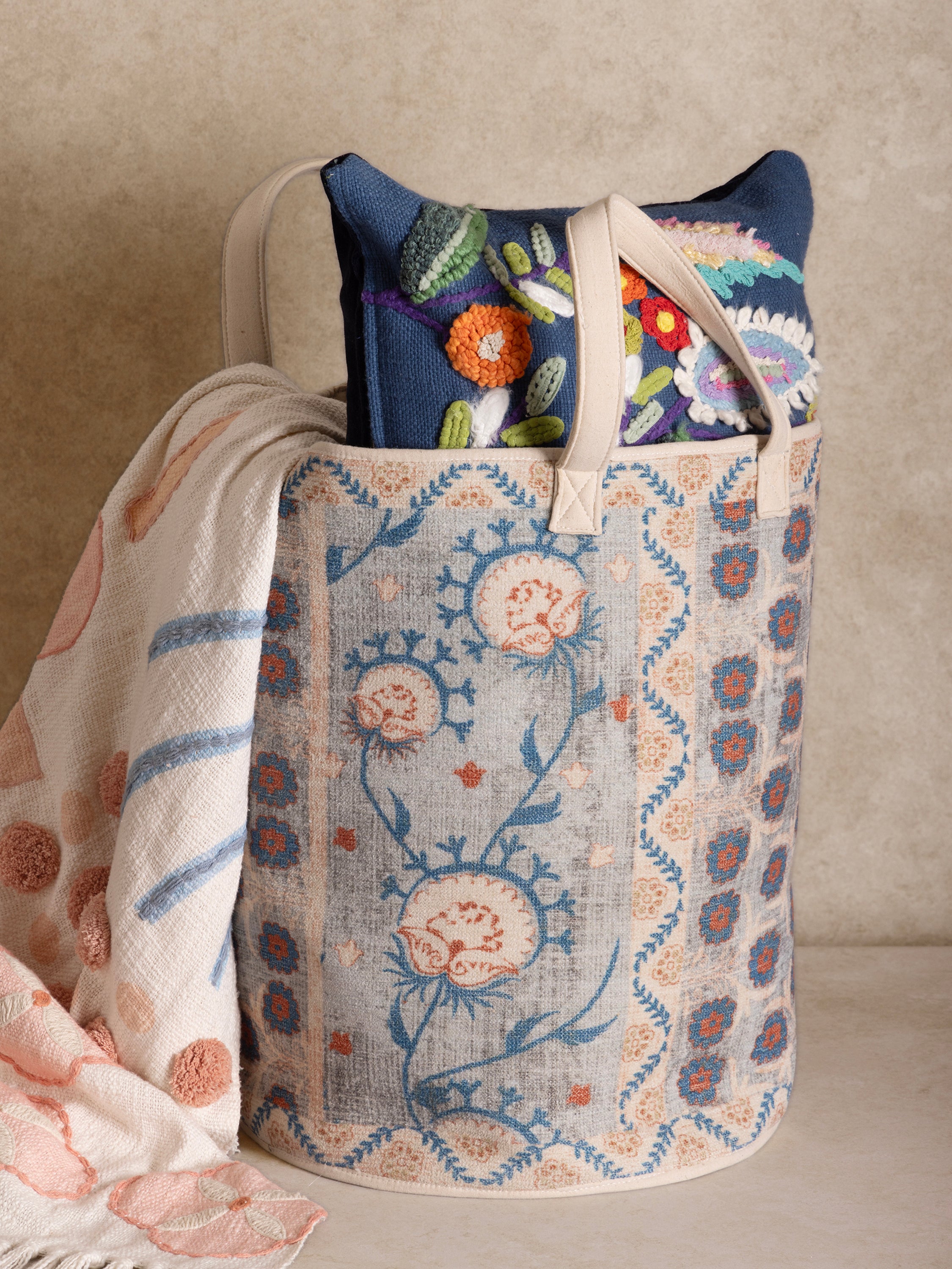 Printed floral laundry hamper with reinforced handles and delicate detailing — elegant home storage