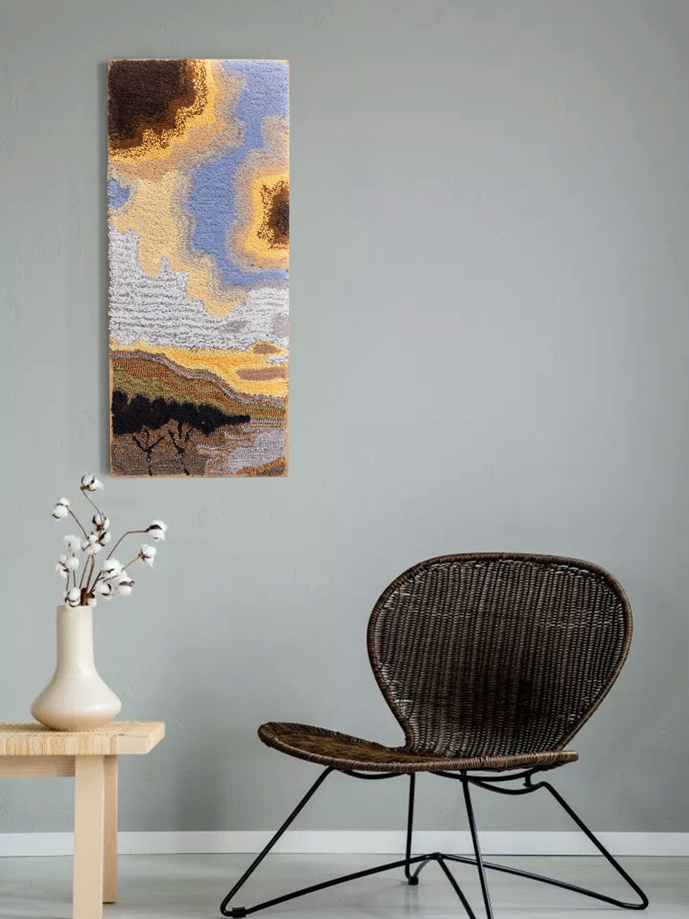 Textured wall hanging in natural cotton-wool blend with sculptural tufted design and warm horizon tones