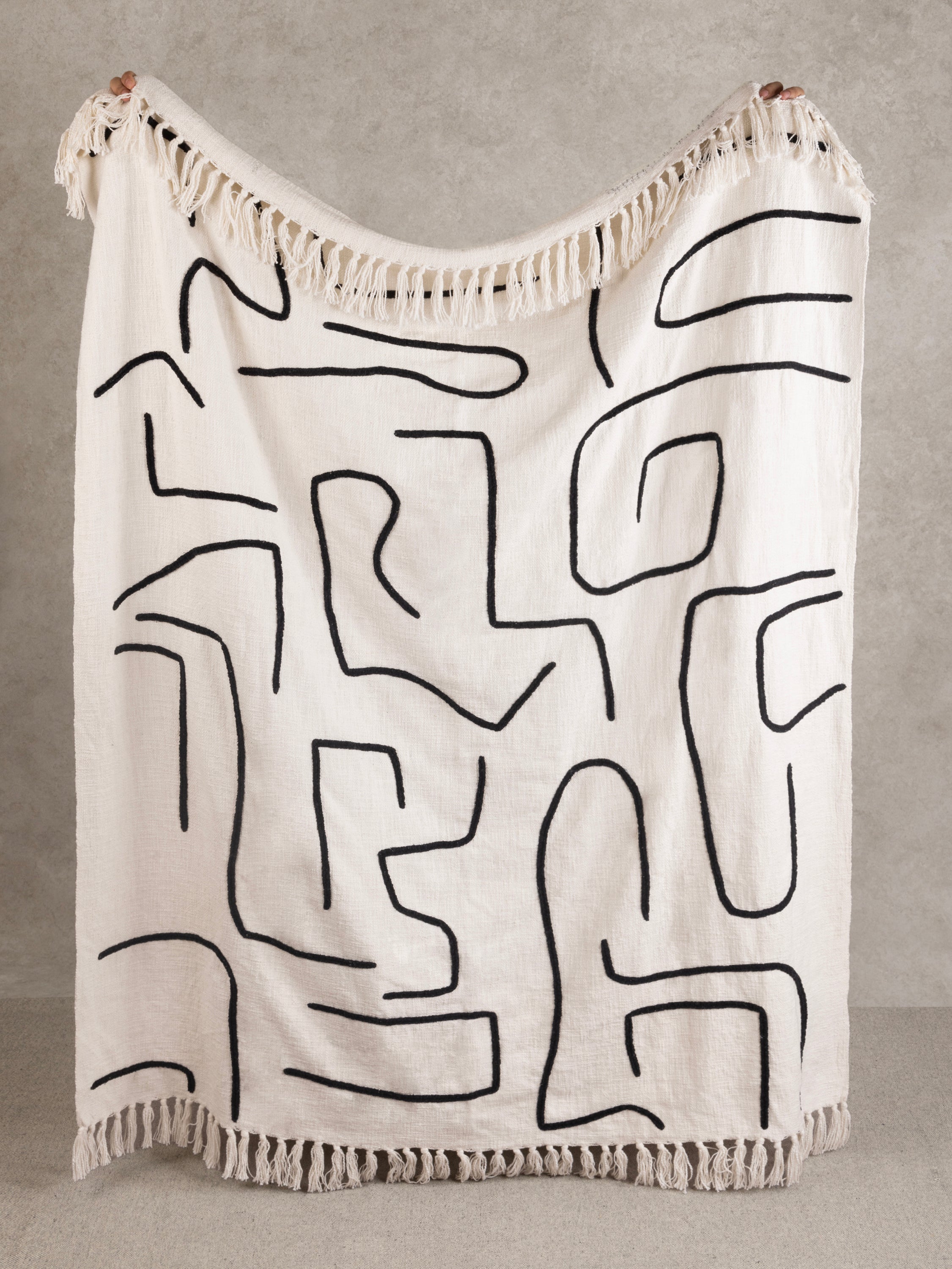 Premium cotton throw blanket with bold abstract print and fringe — luxury handcrafted home accent