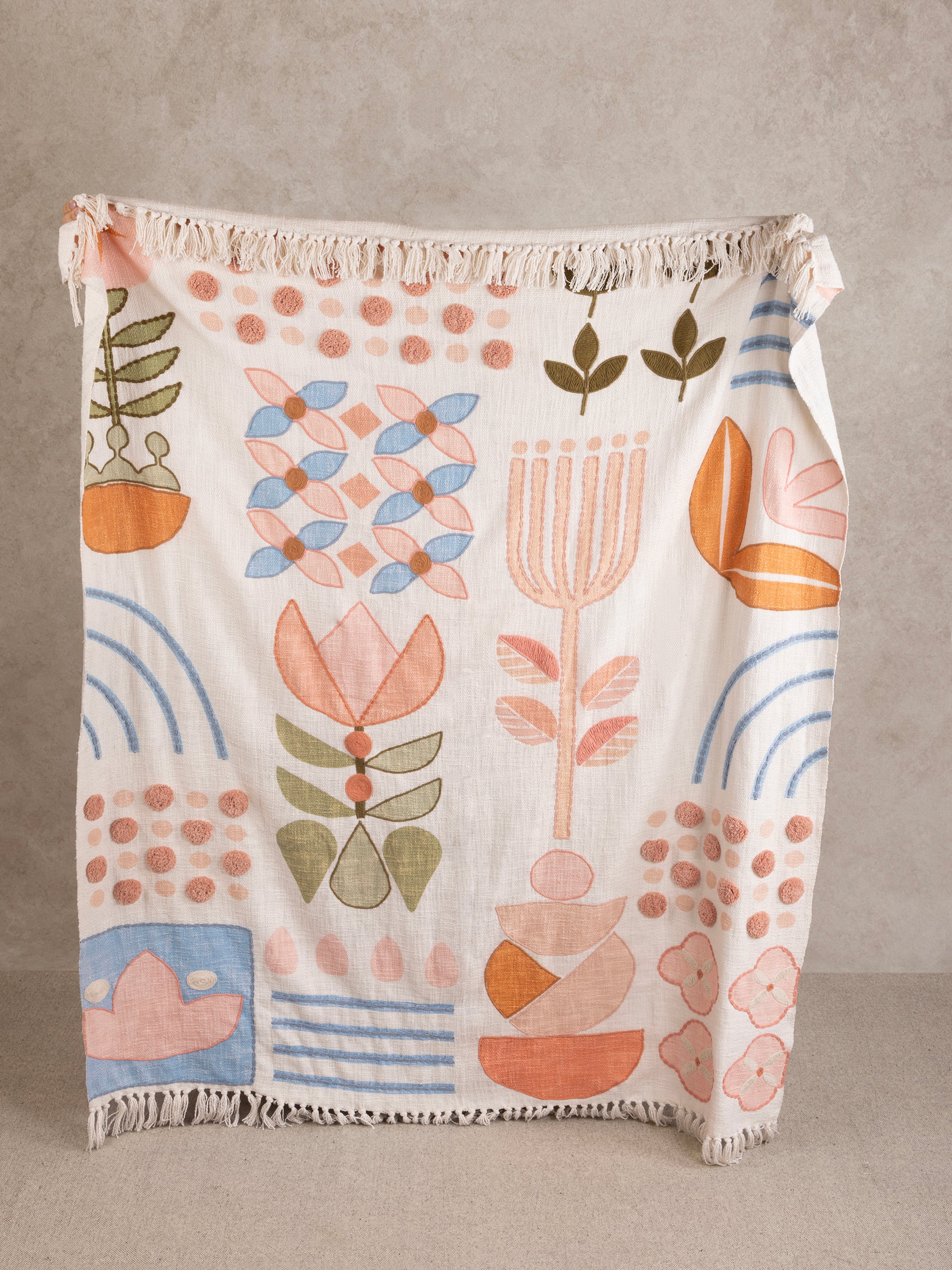 Handcrafted cotton throw blanket with multicolor floral and geometric motifs — artisan home accent