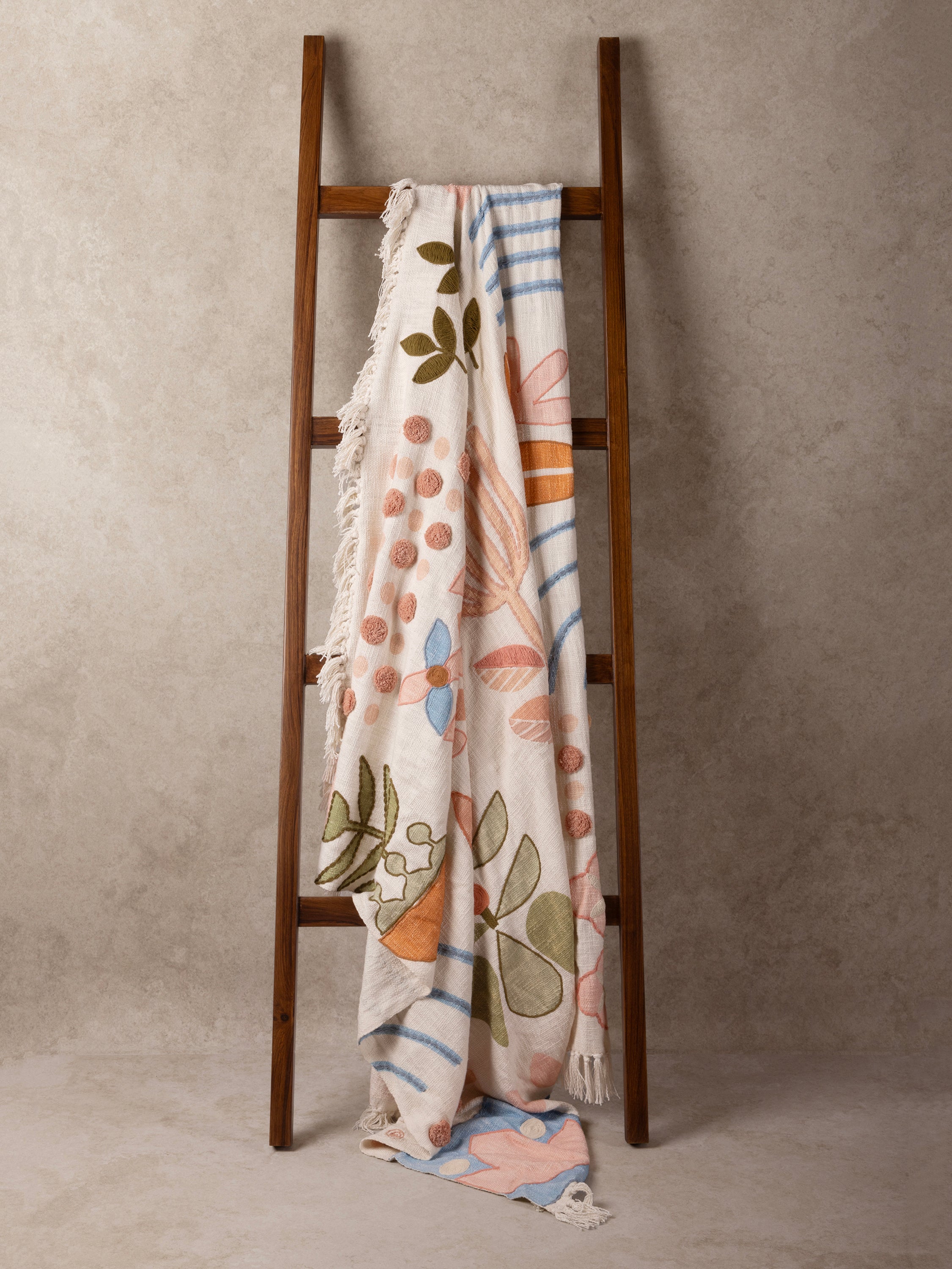 Soft natural cotton throw with fringed edges and intricate pattern — luxury handcrafted design