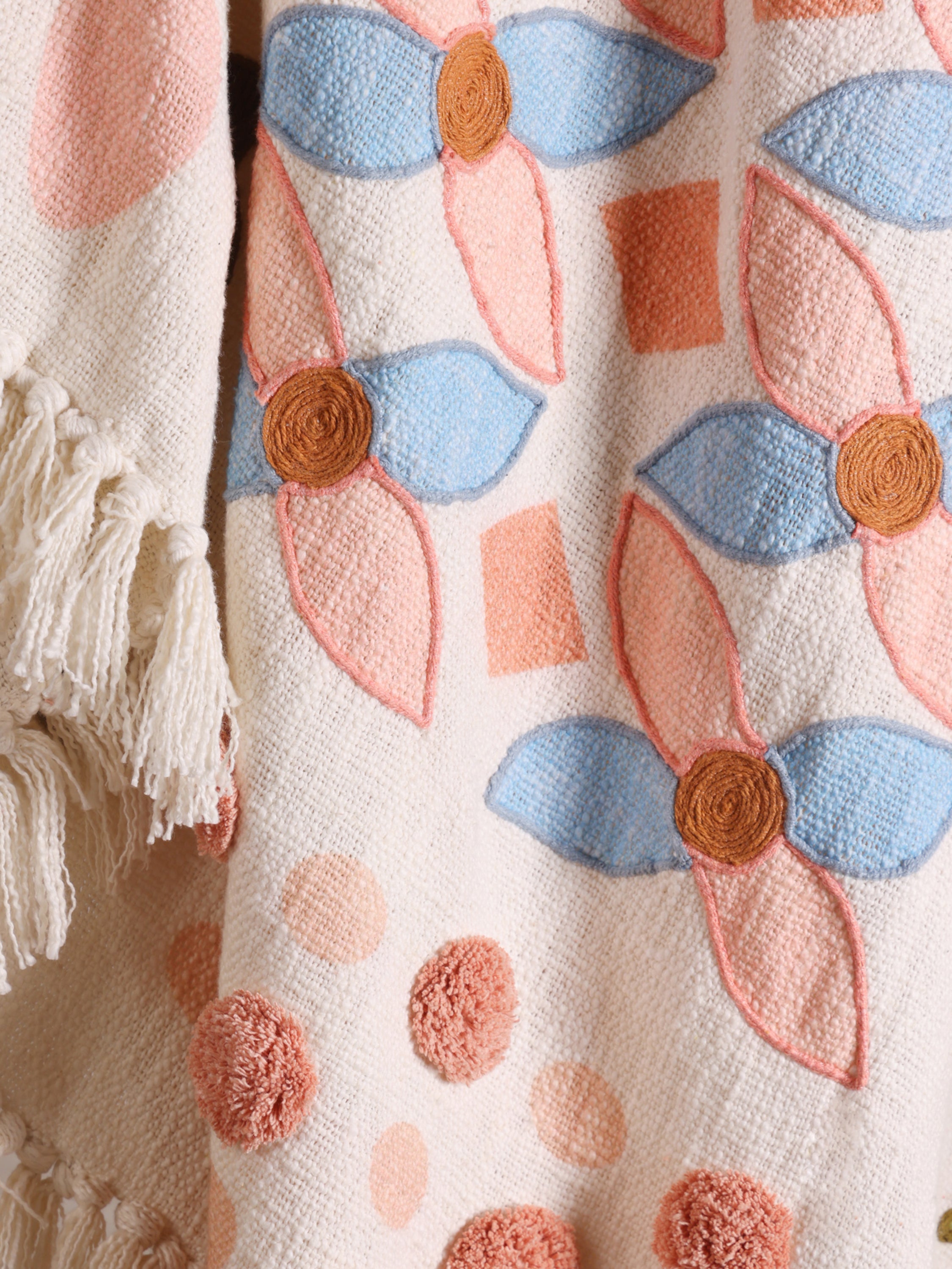 Luxury cotton throw with soft woven texture and artisan details — elegant décor layer