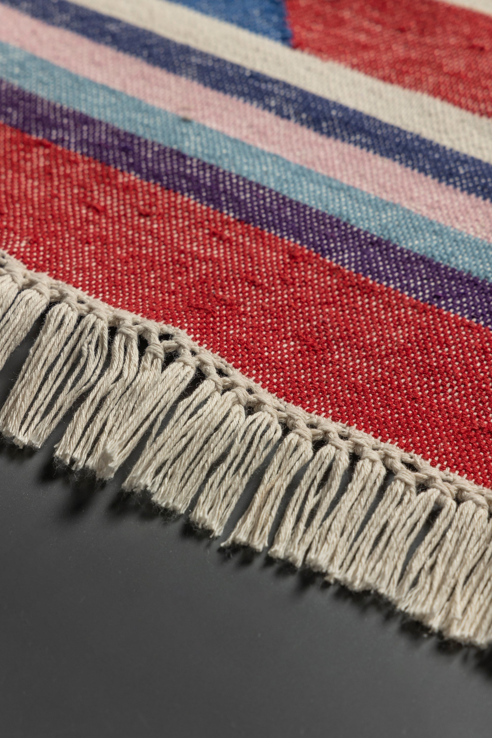 Artisan-made cotton runner rug with vibrant pattern and low-profile weave — luxury narrow-space flooring