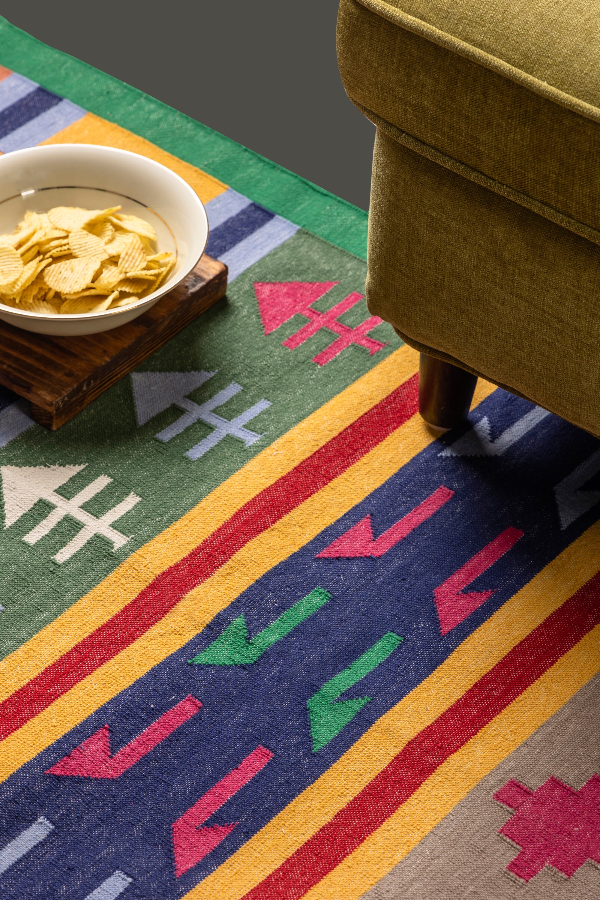 Handwoven antique-style Kilim runner rug with bold geometric tribal patterns and a green border