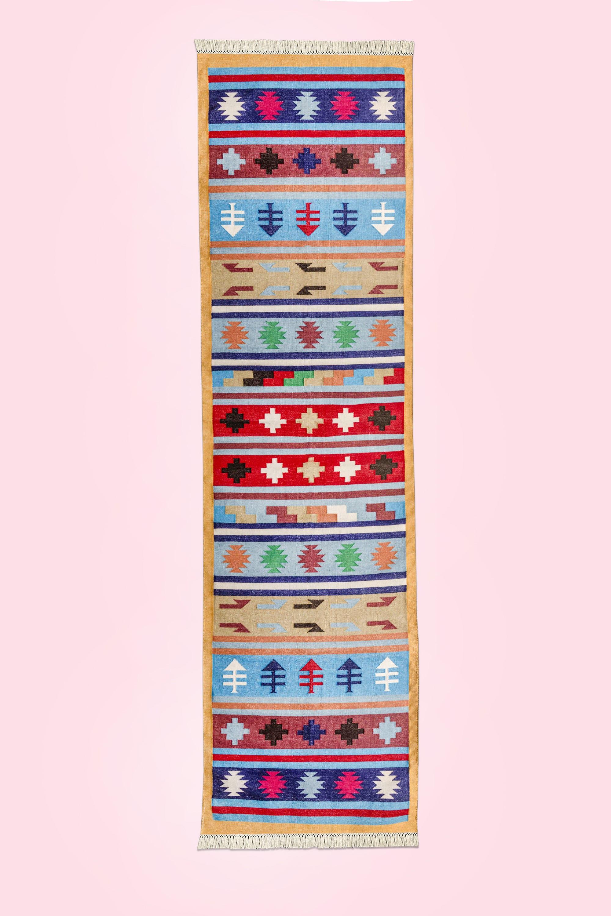 Multicolored handwoven runner rug with intricate ethnic designs and fringe trim