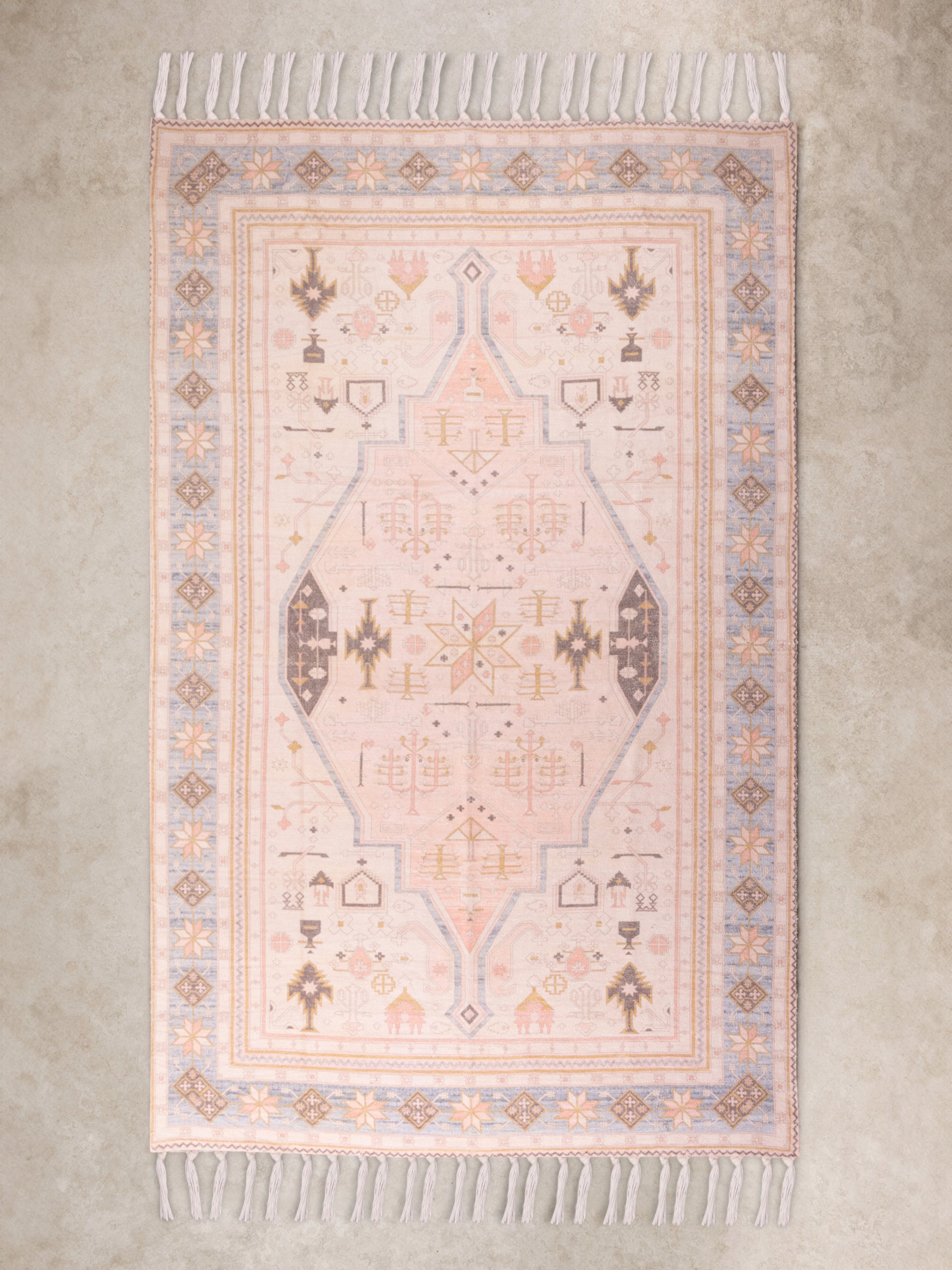 Printed pastel motif area rug 5×8 on natural cotton — luxury artisan floor layer