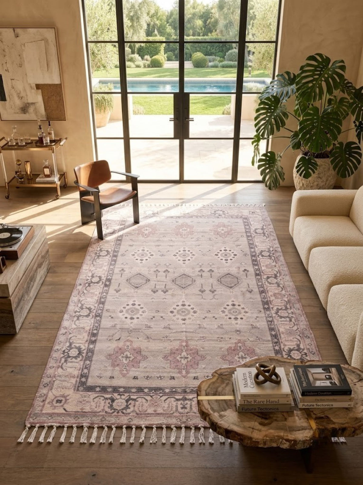 Cotton and viscose rug with fringed short edges, styled on a living room floor beneath furniture.