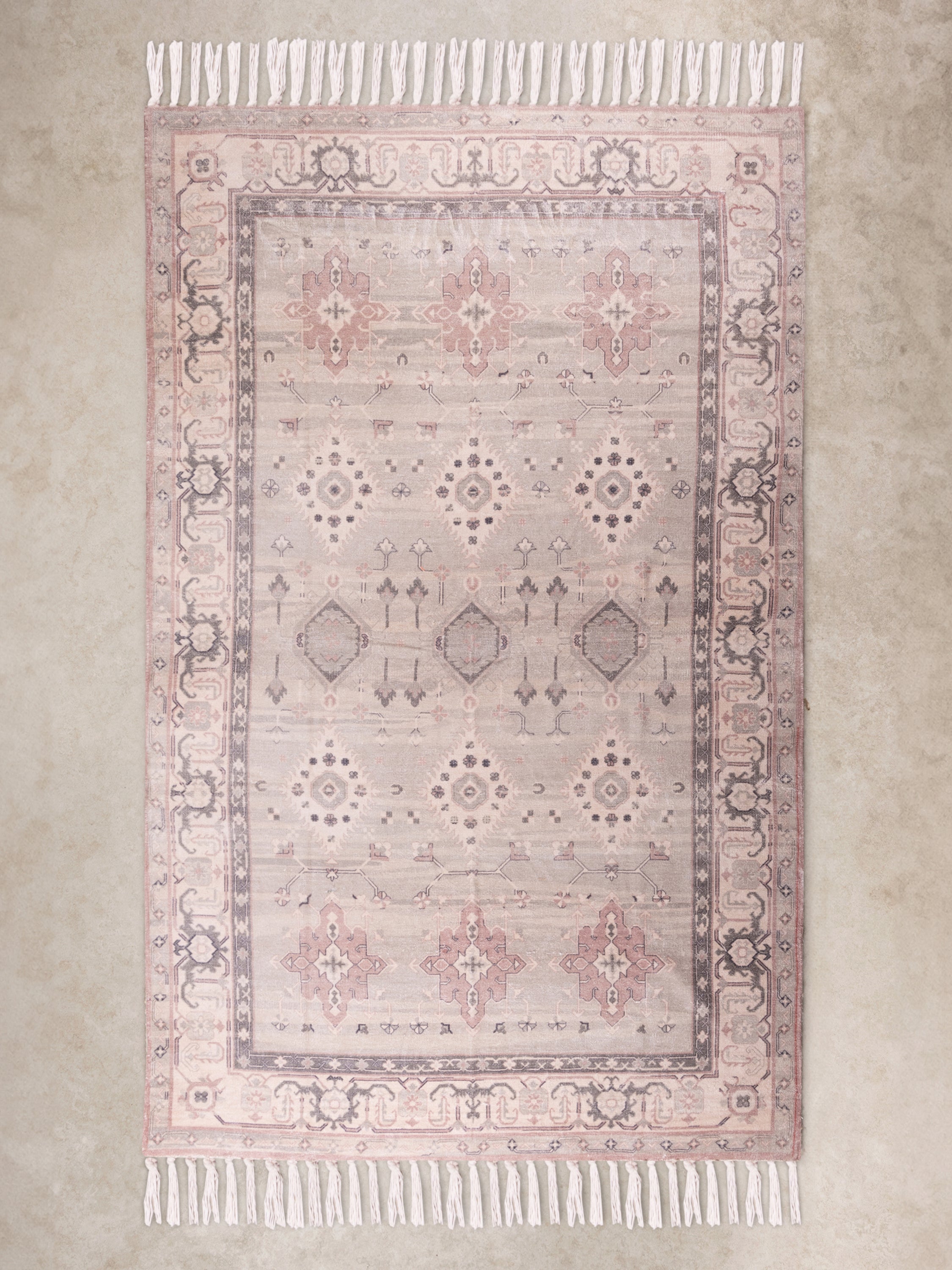 Handwoven cotton area rug 5×8 in muted grey, beige, and pale pink tones — artisan craftsmanship