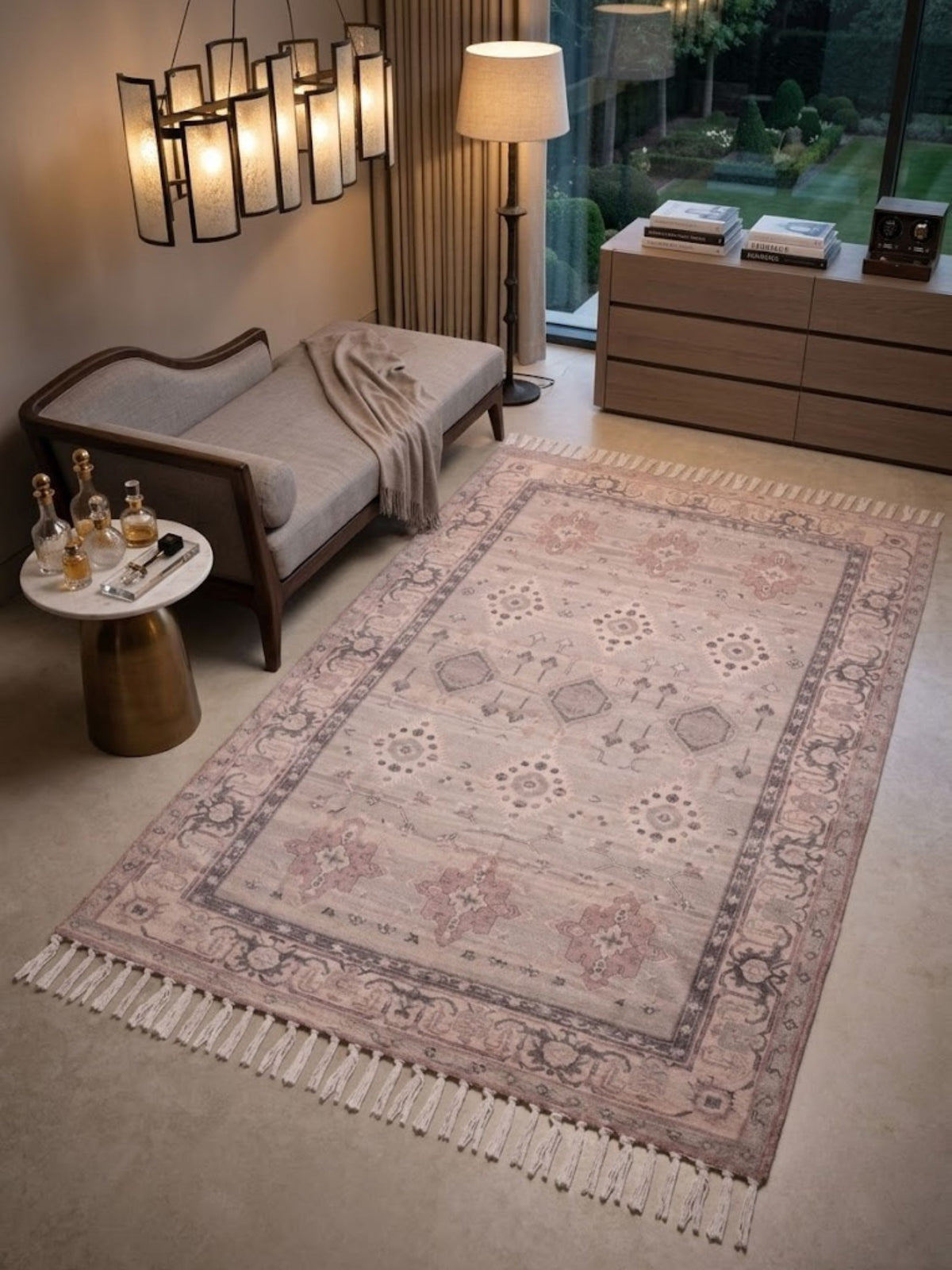 Cotton and viscose rug with a medallion field pattern, placed at the foot of a bed.