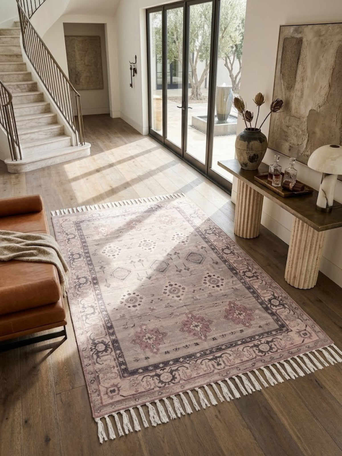 Cotton and viscose rug shown along an entryway staircase, illustrating scale and drape.