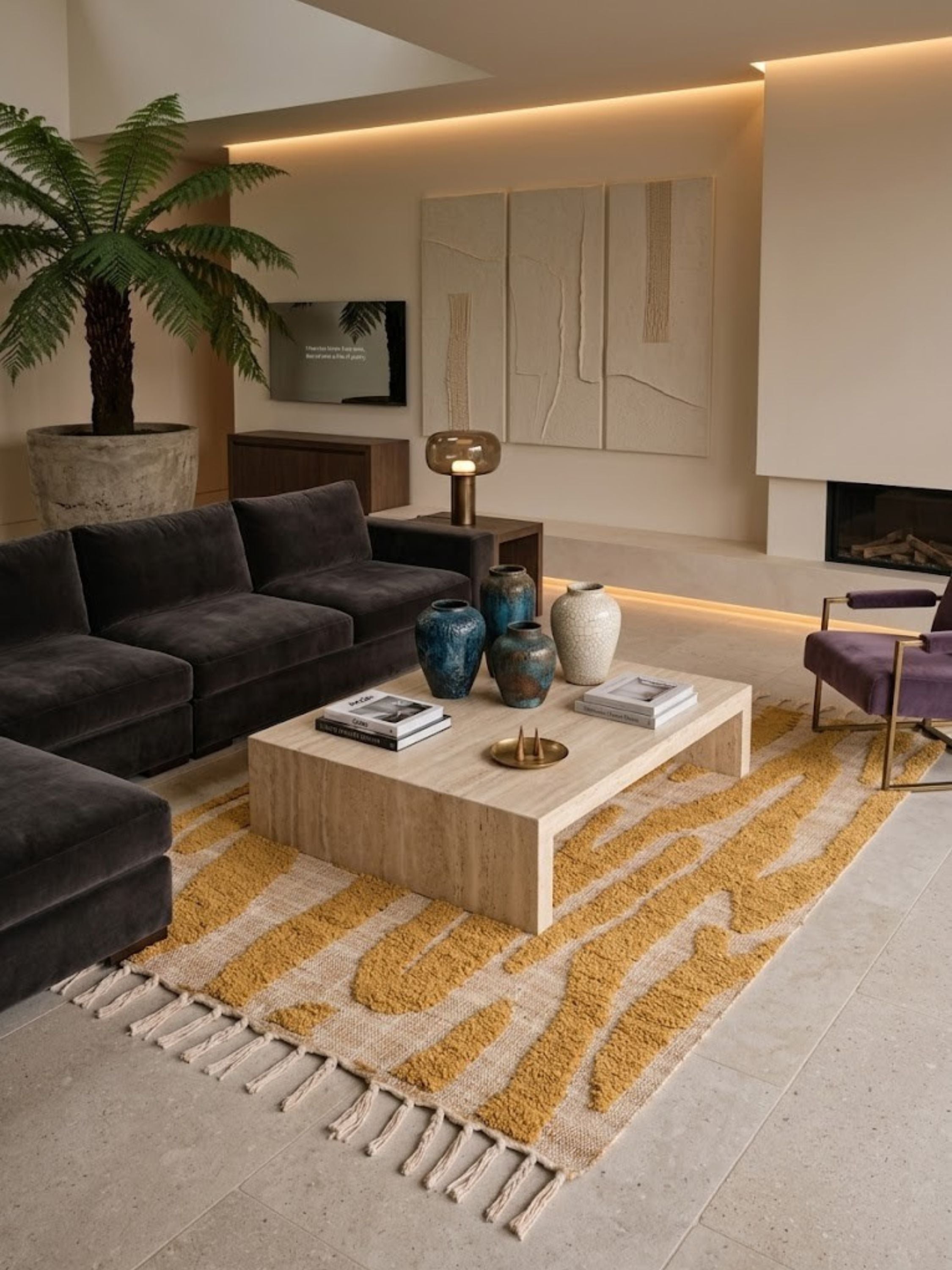 Jute, wool, and cotton rug with a tufted mustard stripe pattern, styled in a living room.