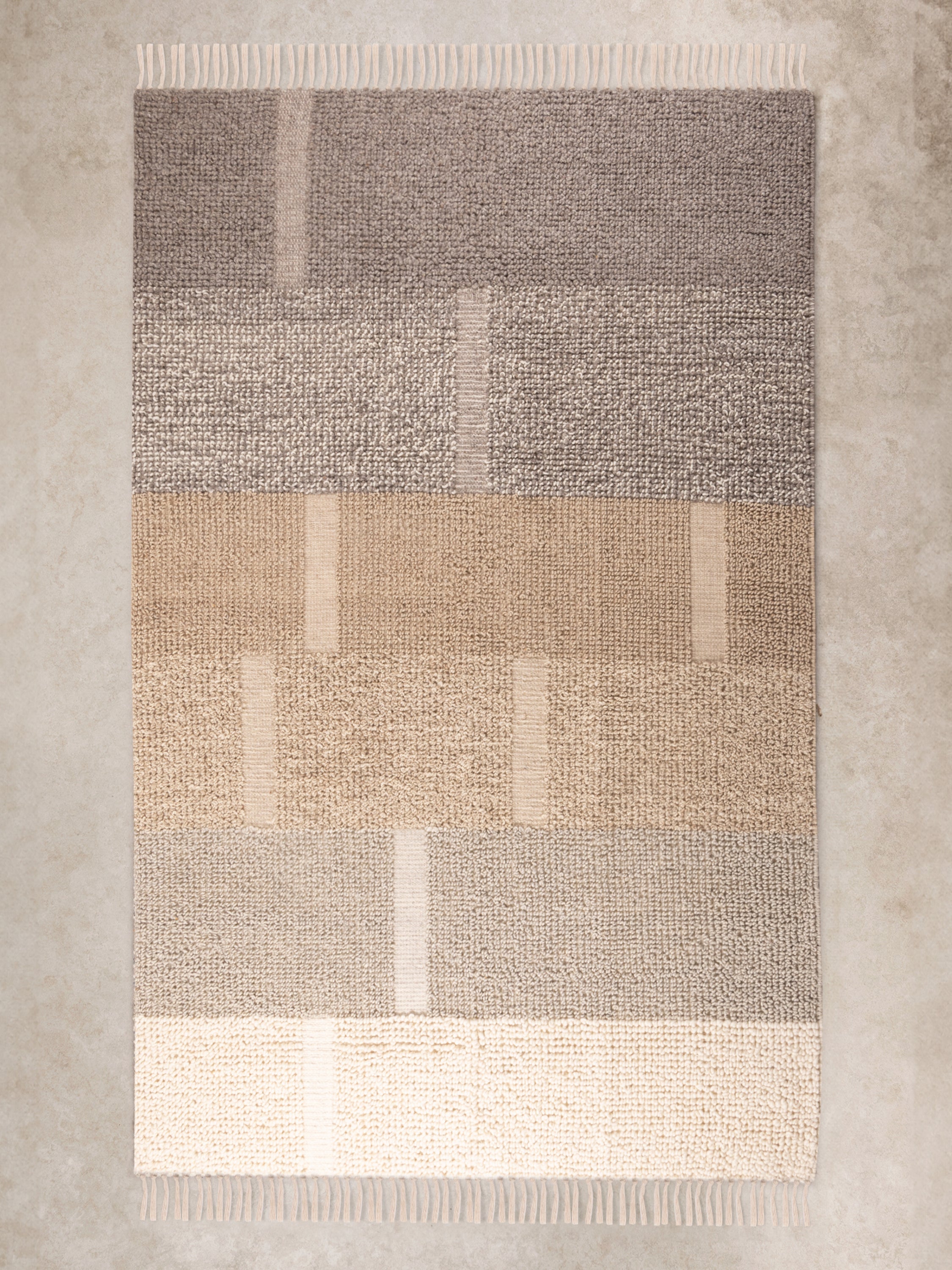 Handwoven wool and cotton area rug 5×8 in brown and beige with raised pile texture — artisan crafted décor