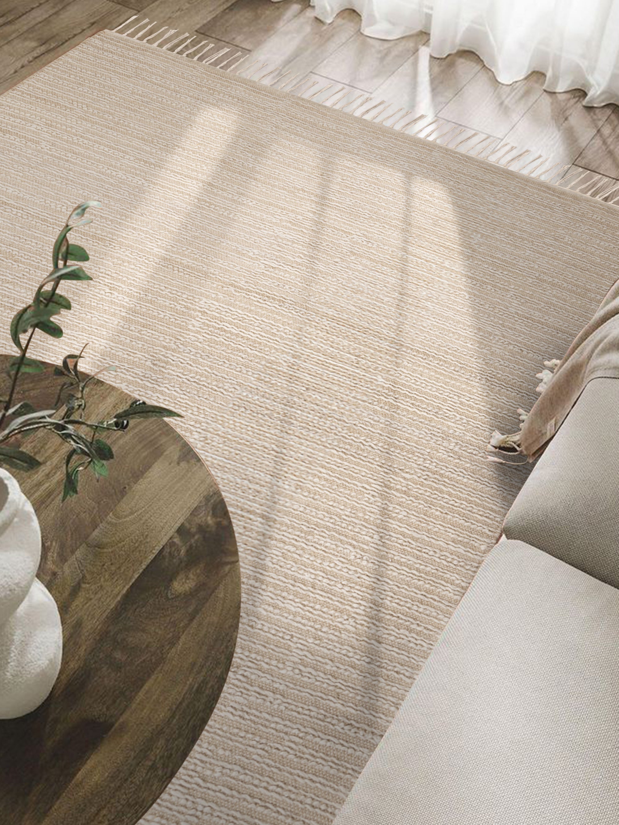 Luxury hand-woven 5′×8′ rug with beige tones and handcrafted finish — timeless floor piece