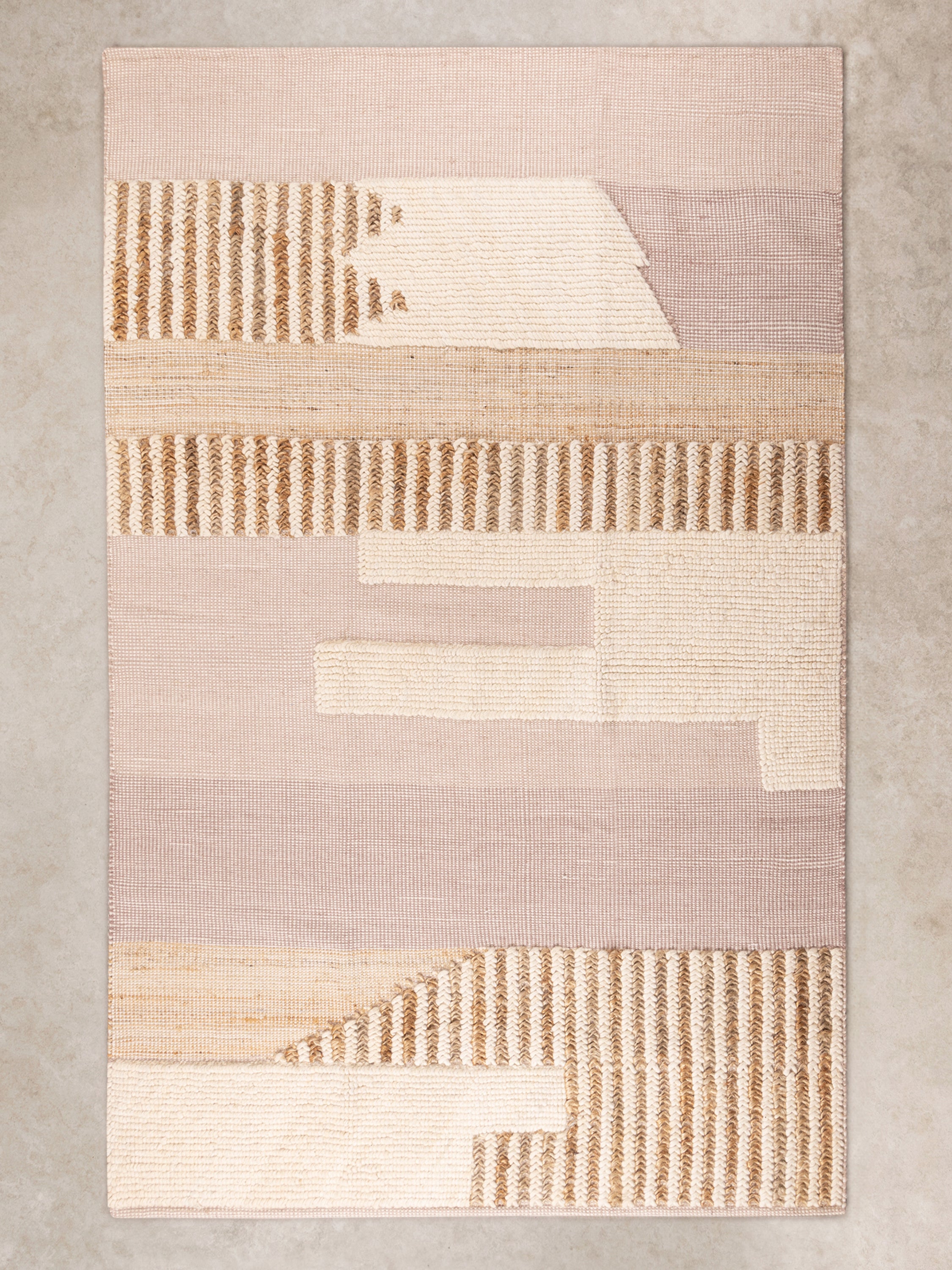 Hand-woven warm beige and brown area rug 5×8 — luxury artisan floor layer