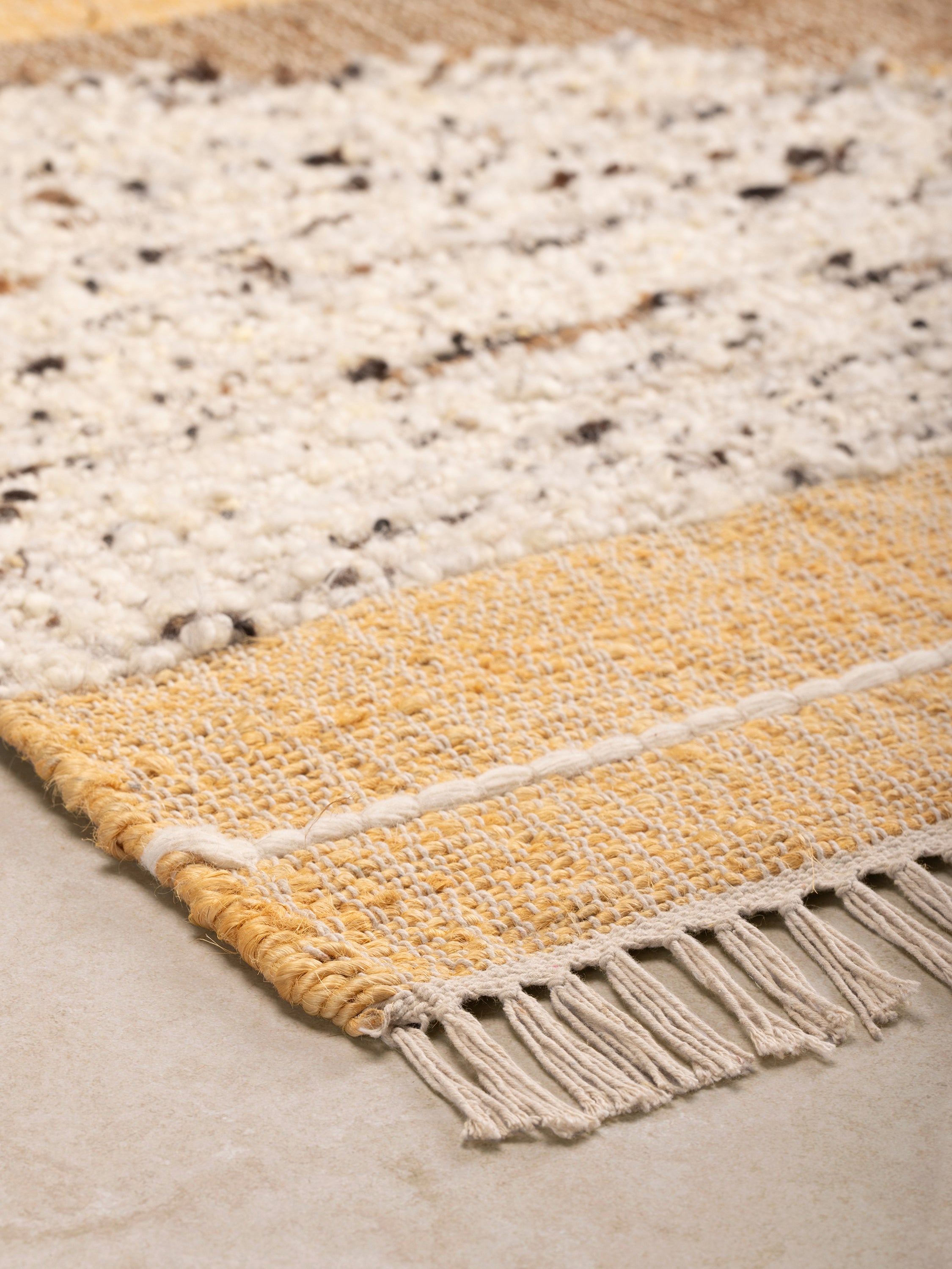 Caracol hand-woven 5×8 area rug in abstract soft colour palette — timeless textured décor