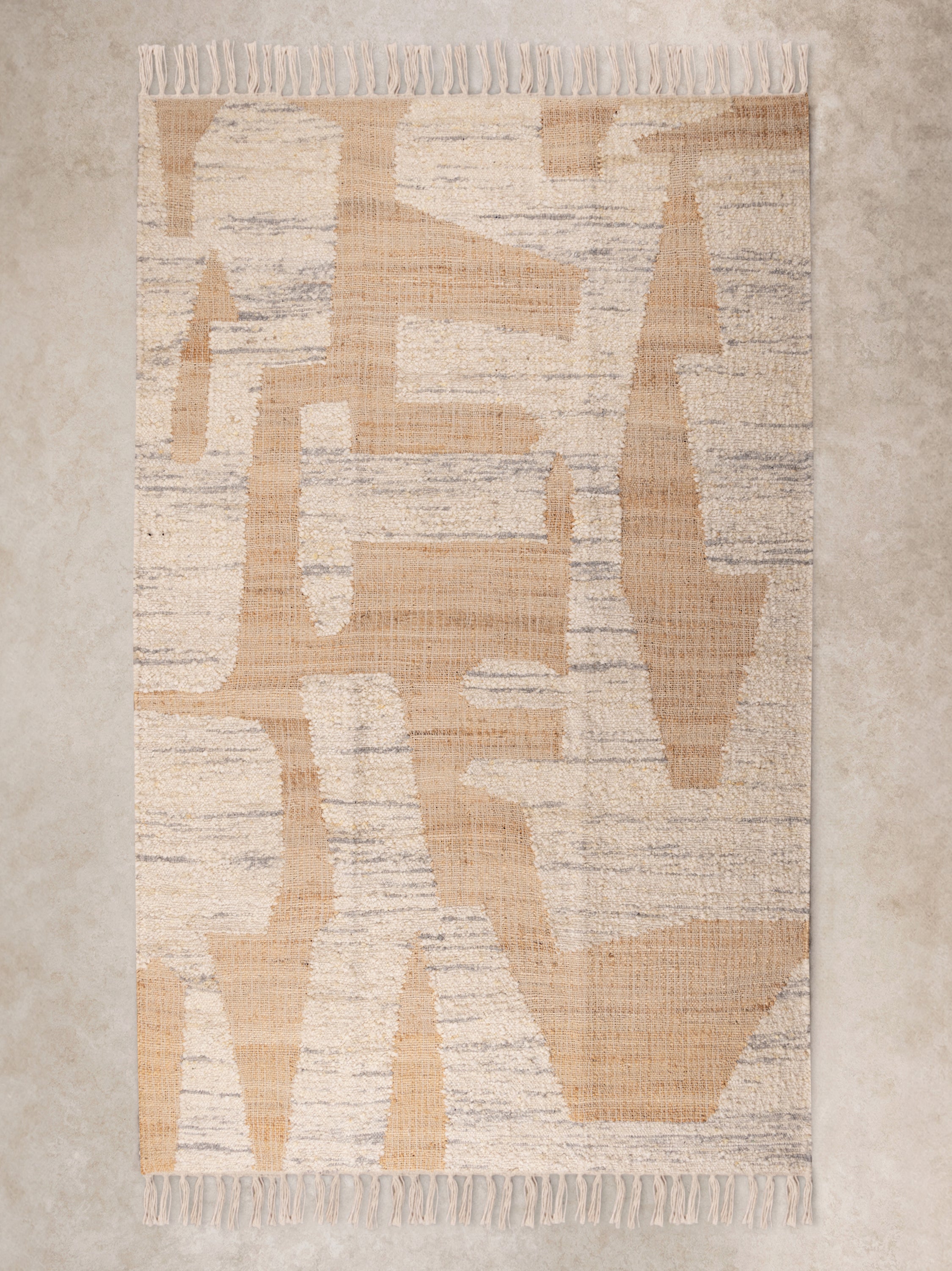 Neutral beige and brown abstract area rug 5×8 with fringe — luxury sculptural floor layer