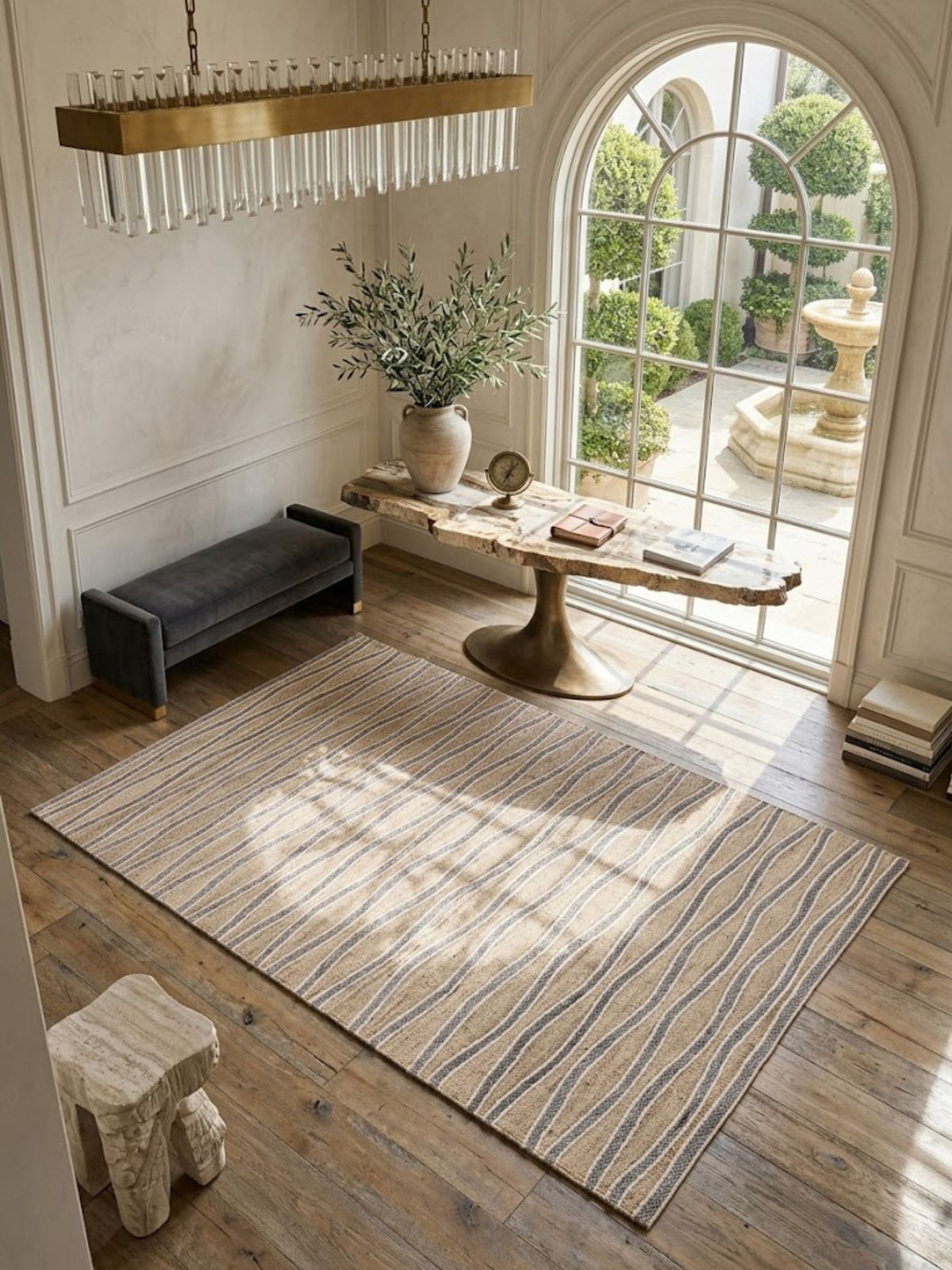 Wool Milford rug placed beneath a console, showing cream and gray wave cords on beige.
