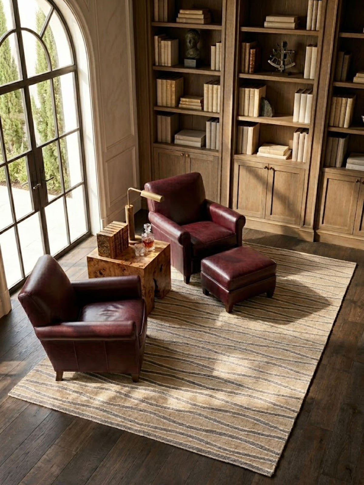 Wool Milford rug anchoring a seating area, with cream and gray wave lines across the beige ground.