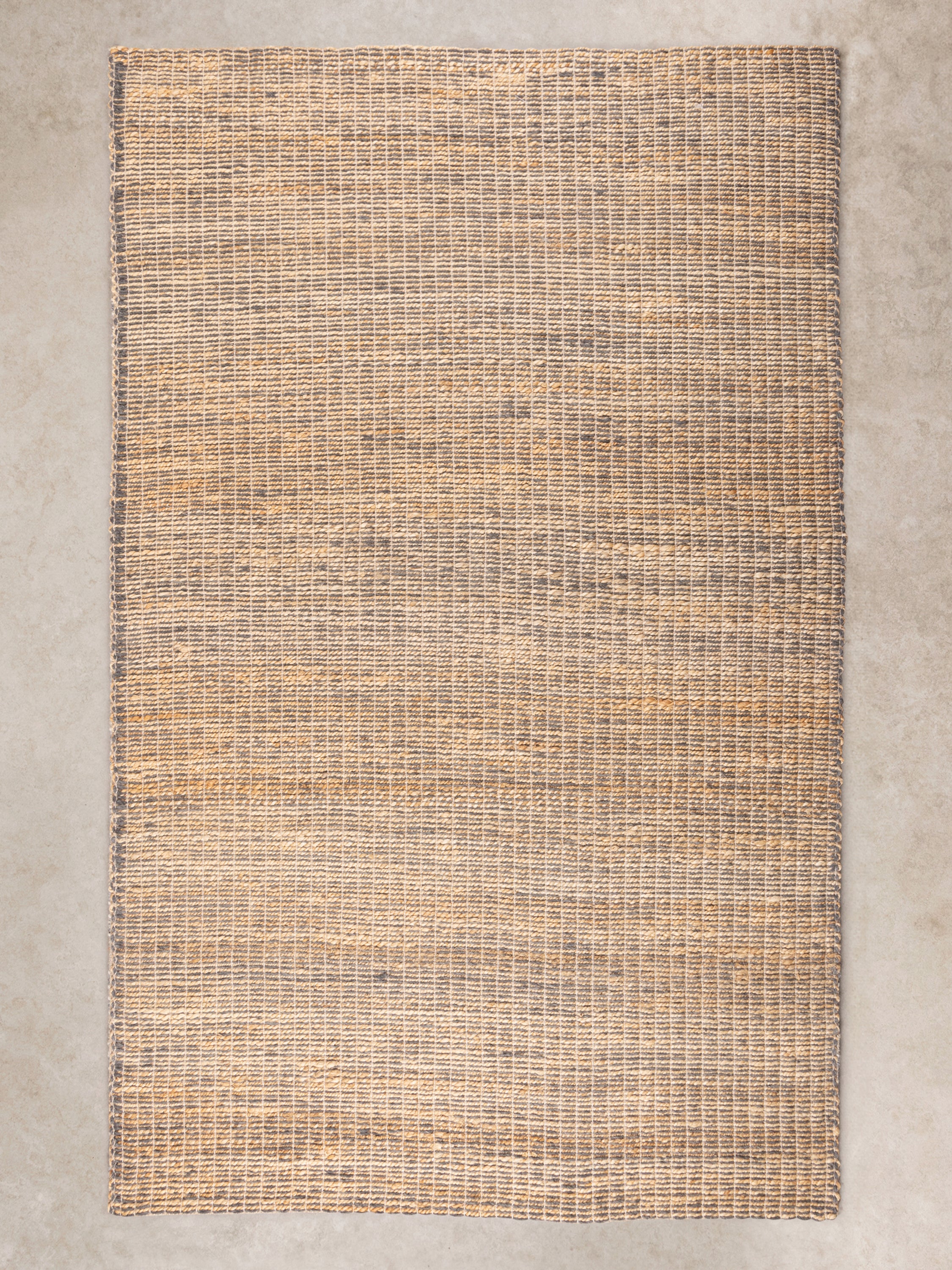 Handwoven wool and jute flatweave rug in natural tones, perfect for a boho-chic home decor style