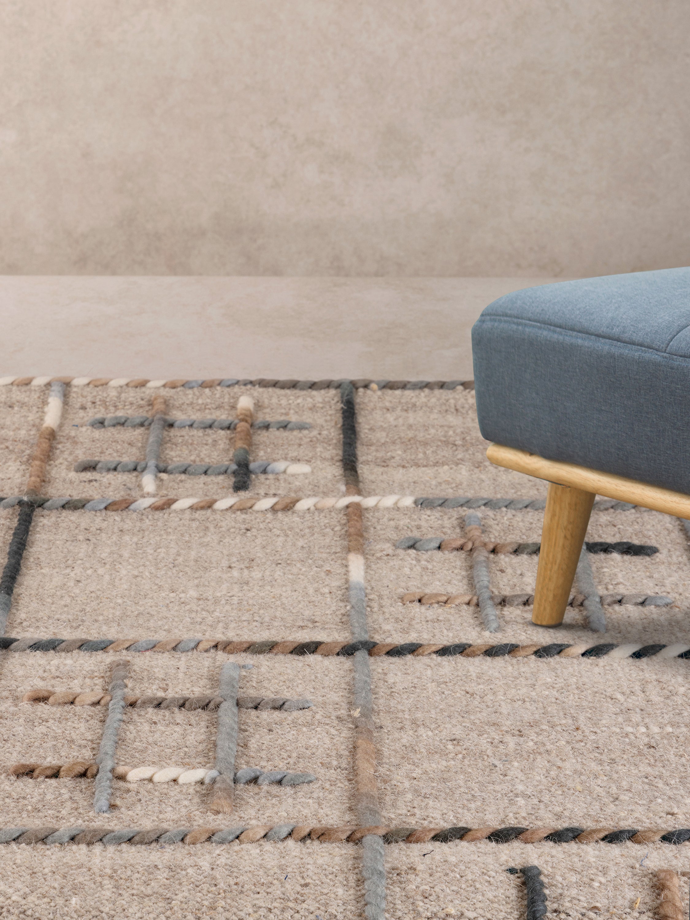 Luxury wool rug with a geometric grid design, perfect for contemporary and Scandinavian-style interiors