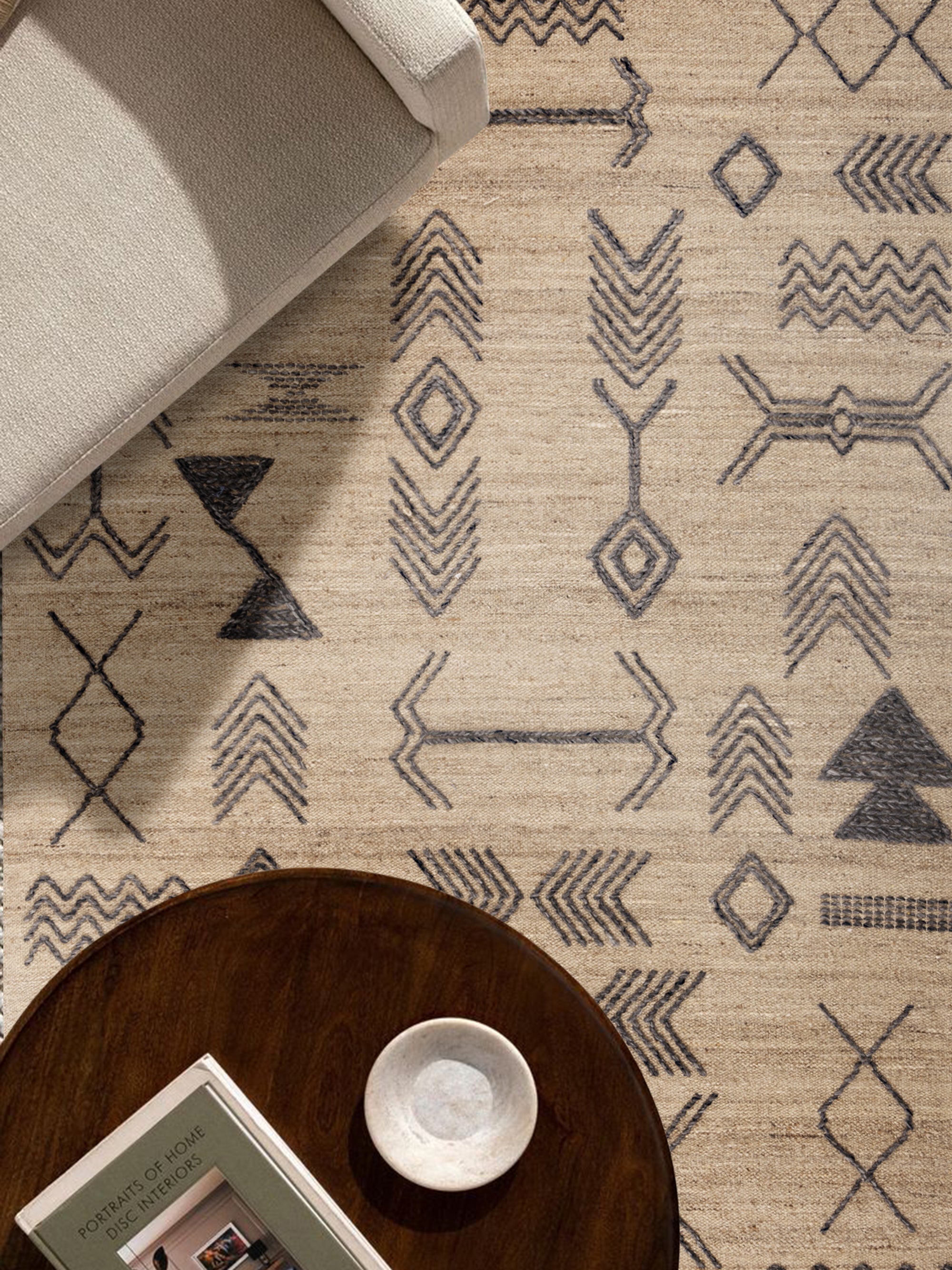 Premium woolen carpet with artisanal tribal motifs, adding warmth and texture to any space