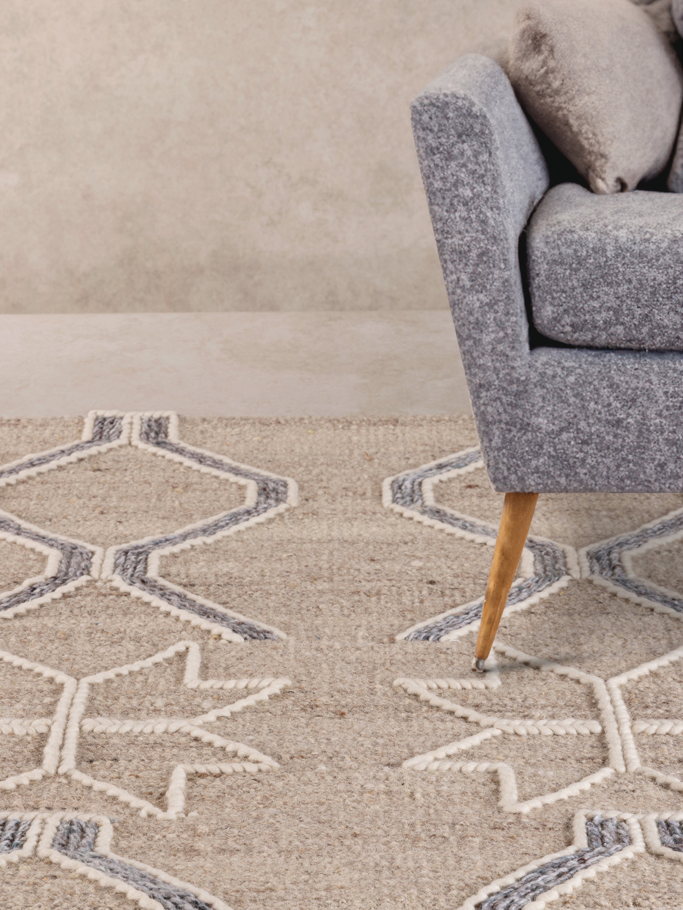 Designer beige and gray area rug with intricate star and lattice design, ideal for living rooms and bedrooms