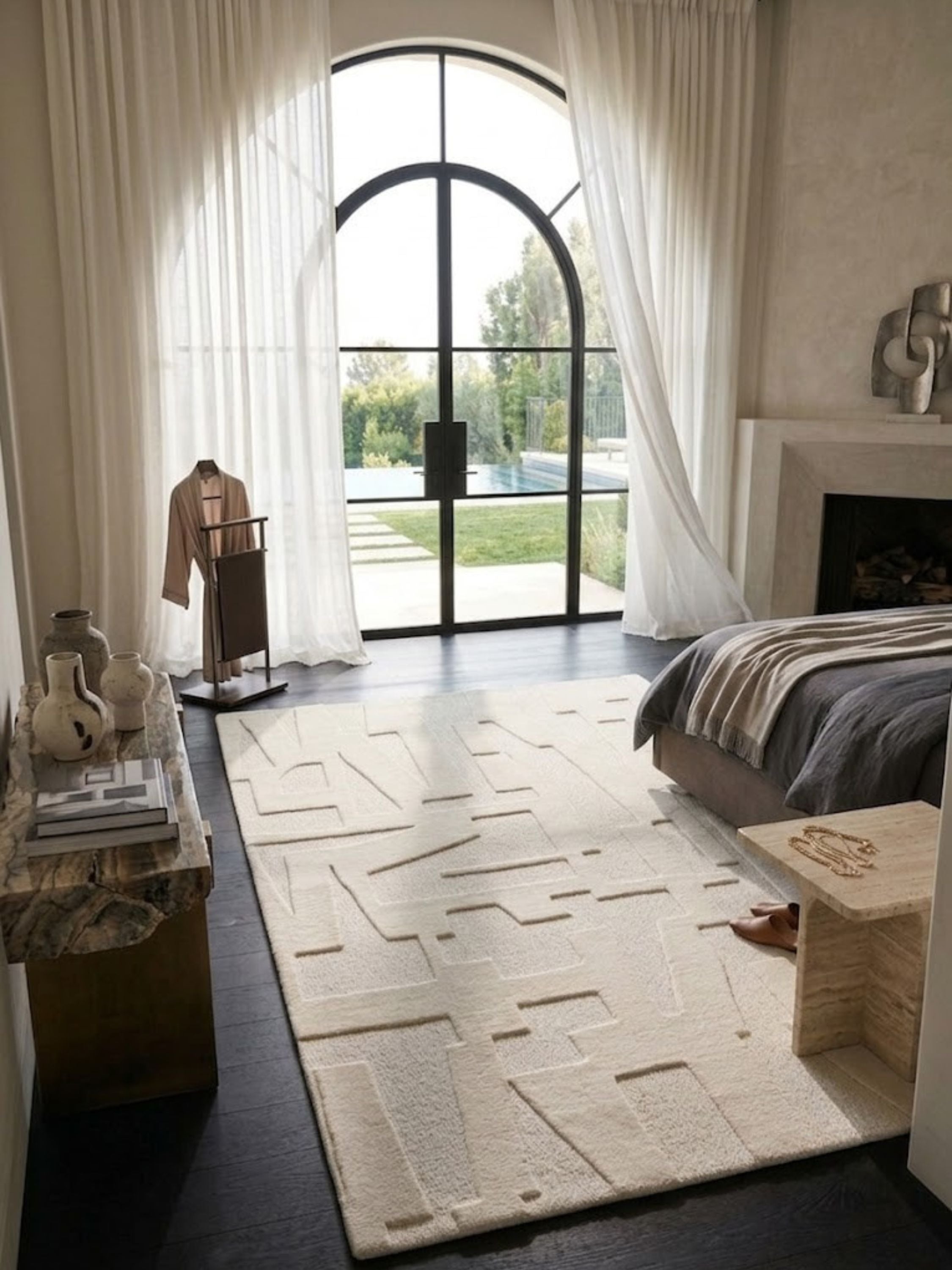 Ivory wool and cotton rug with a high-low pile texture, styled in a primary bedroom.