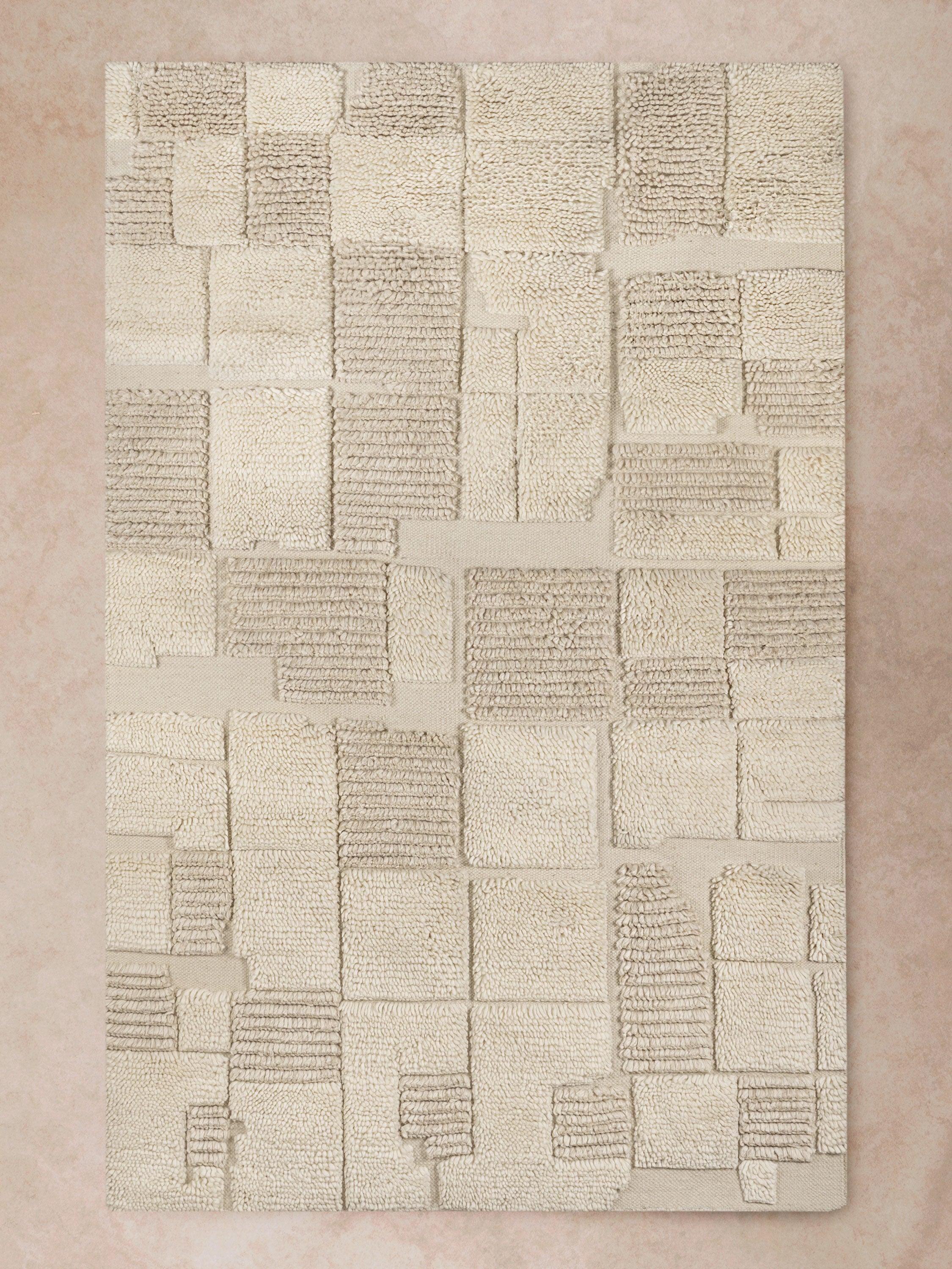 Winnipeg hand-tufted wool rug in ivory and taupe block weave top view