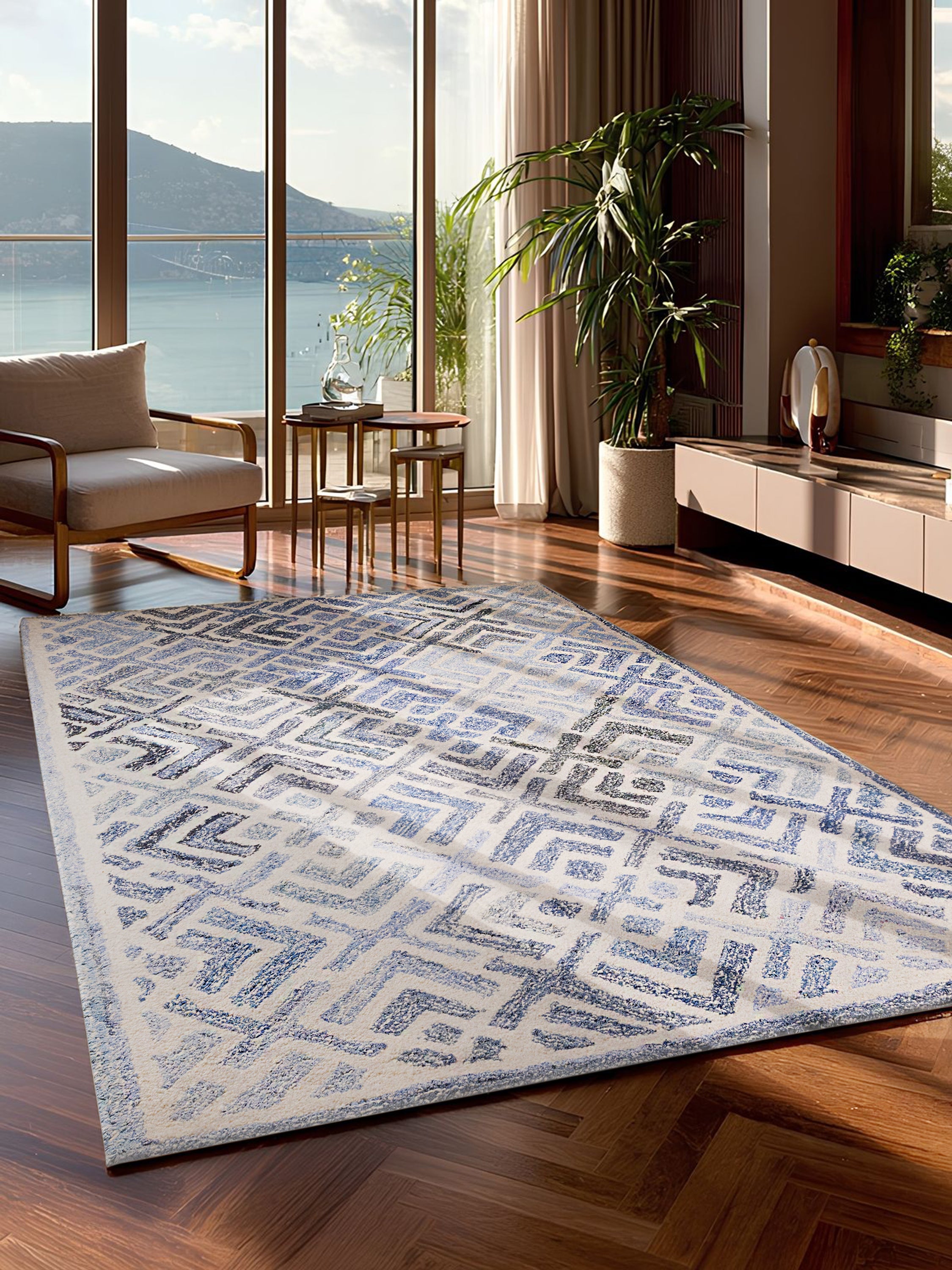 Santorini rug in an ocean-view living room, showcasing its plush nautical aesthetic and handcrafted character