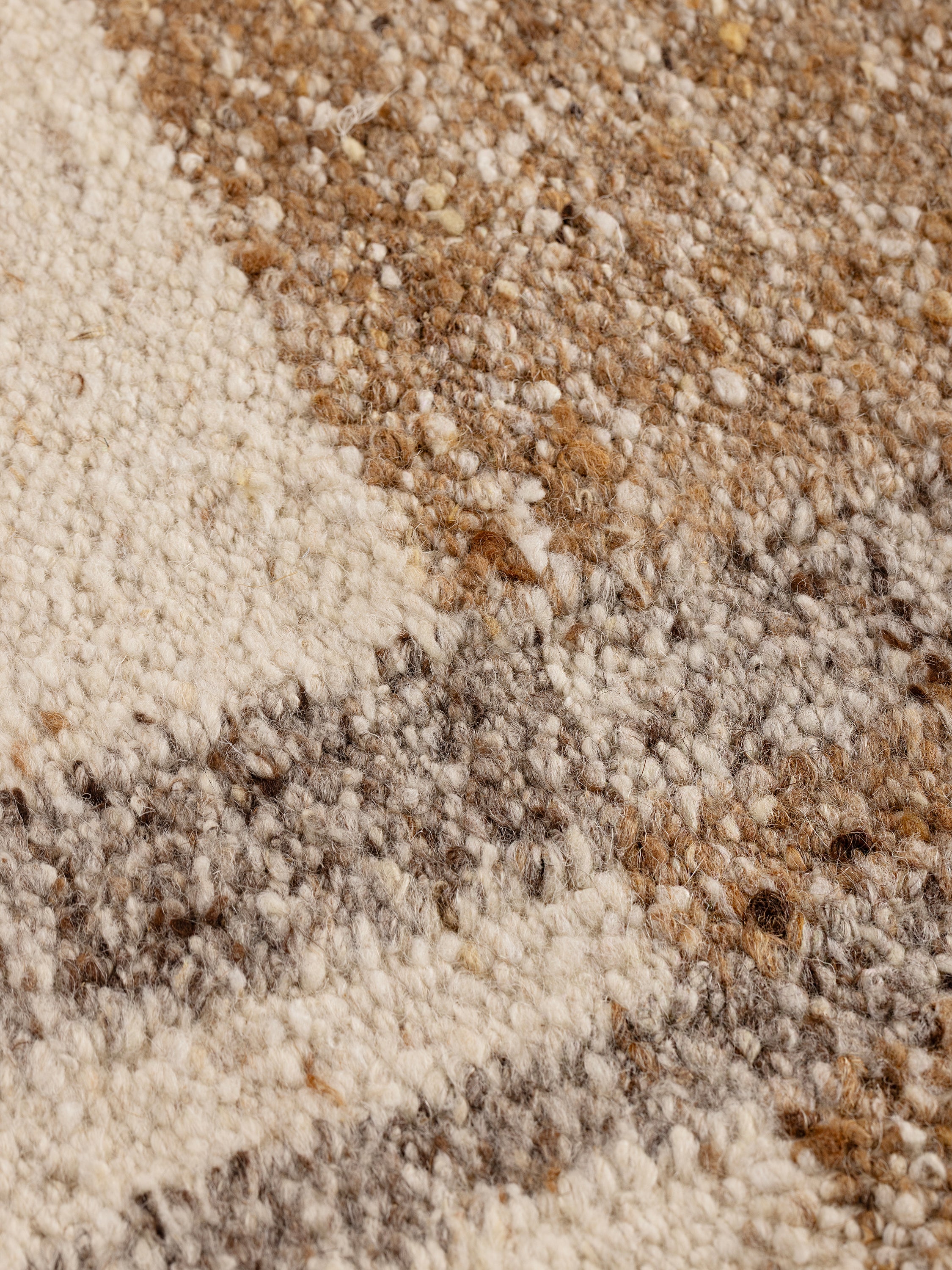 Close-up of Tirana rug texture highlighting flatweave construction and natural wool fibers