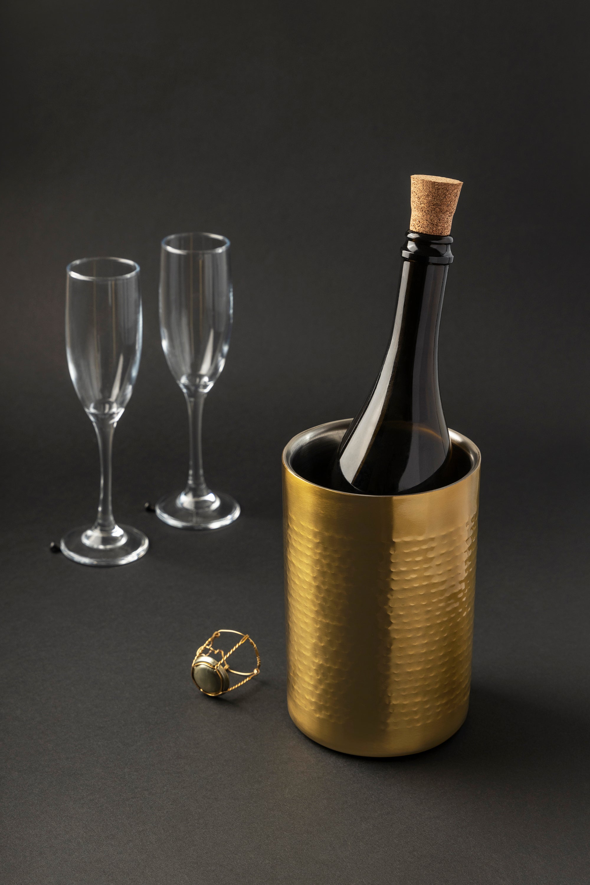 Polished stainless steel wine cooler with hand-finished gold tone and textured surface — handcrafted design object